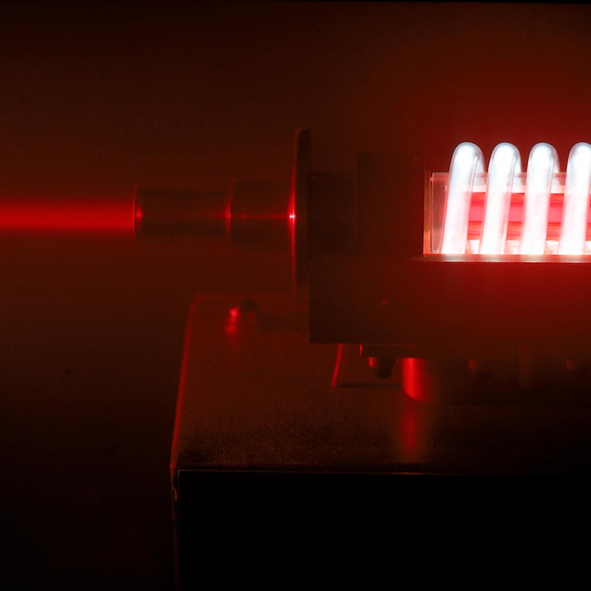 Illuminated coils of projector used to create lase