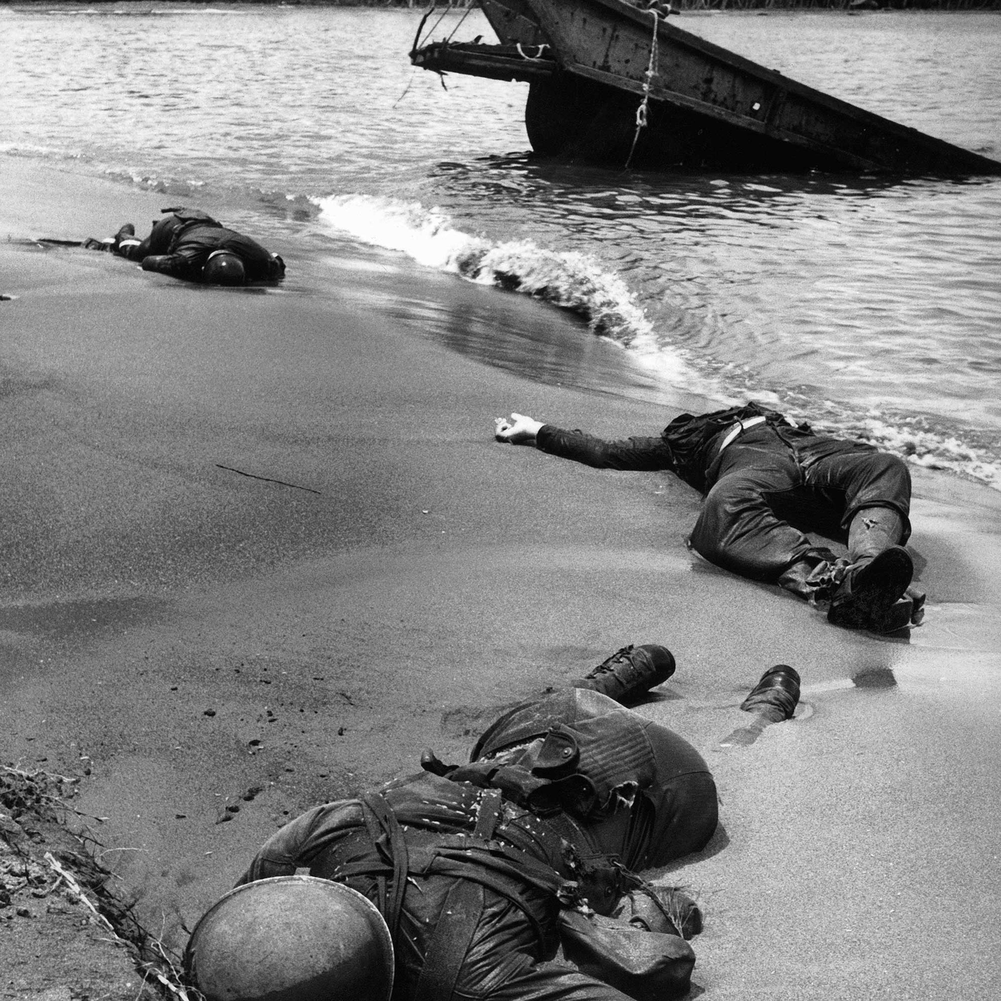 "Three dead Americans on the beach at Buna."