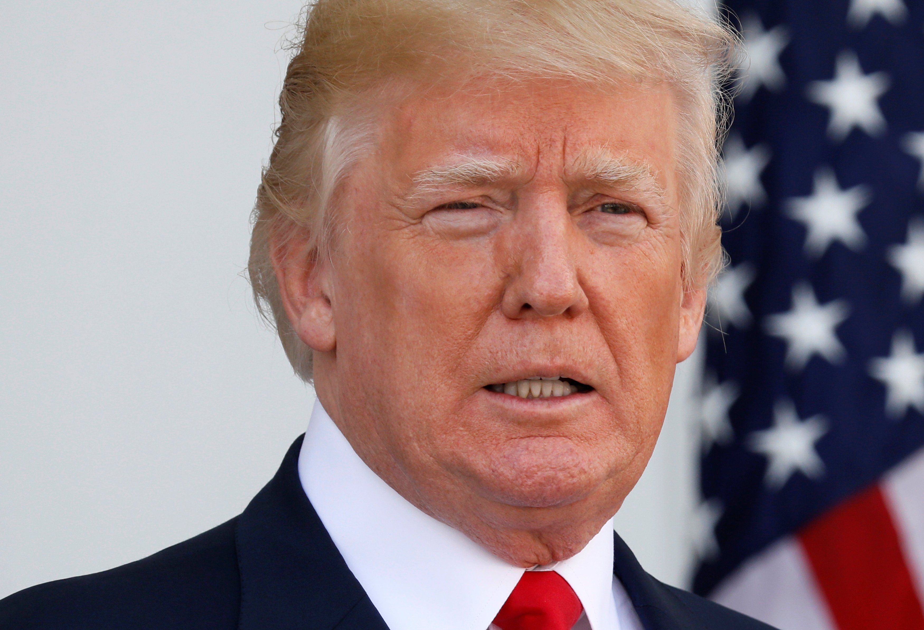 President Donald Trump speaks to reporters at Trump's golf estate in Bedminster, New Jersey Aug. 10, 2017.