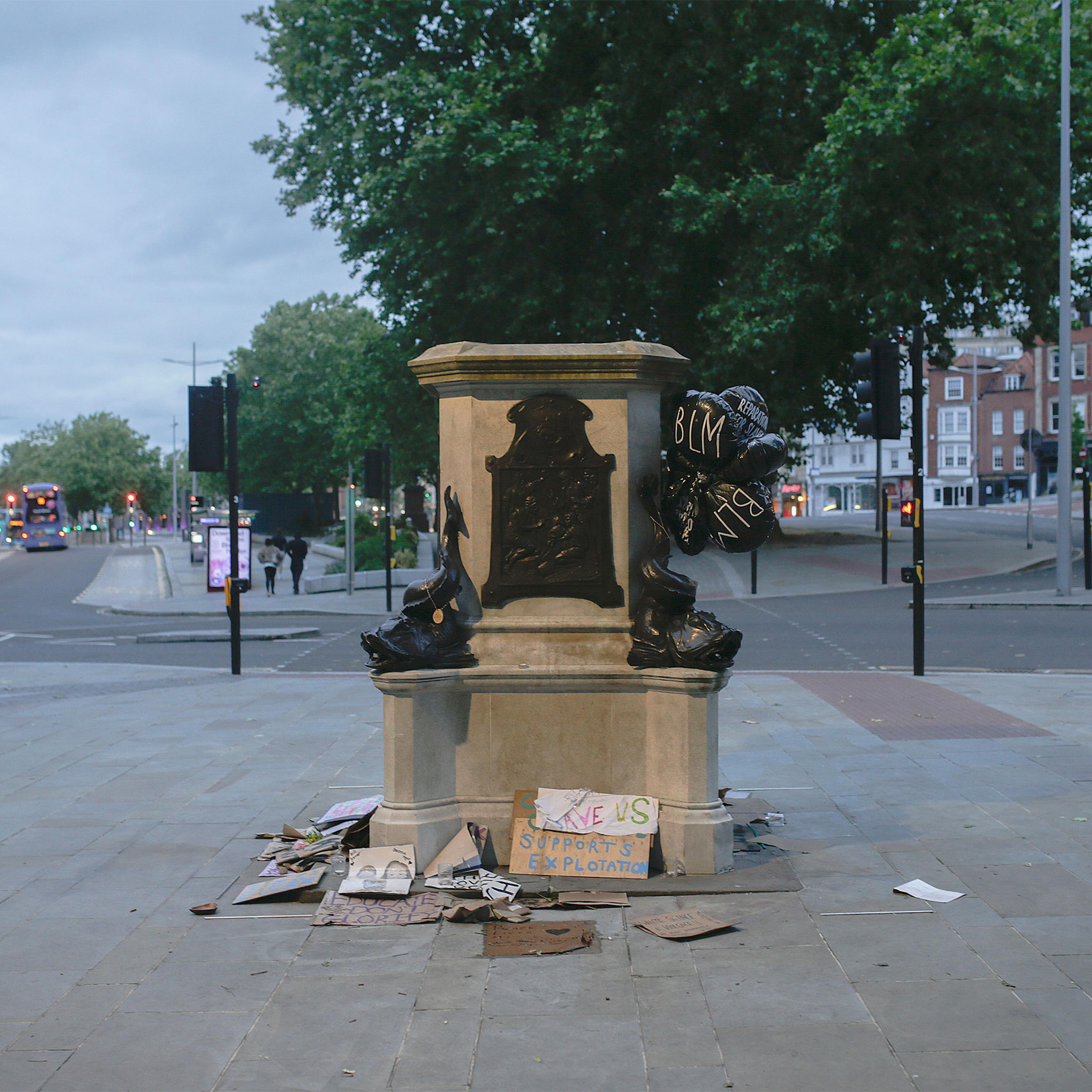 The plinth of the statue of Edward Colston in Bristol, England, is now surrounded by messages of support for the Black Lives Matter movement, June 11, 2020. (James Beck/The New York Times)