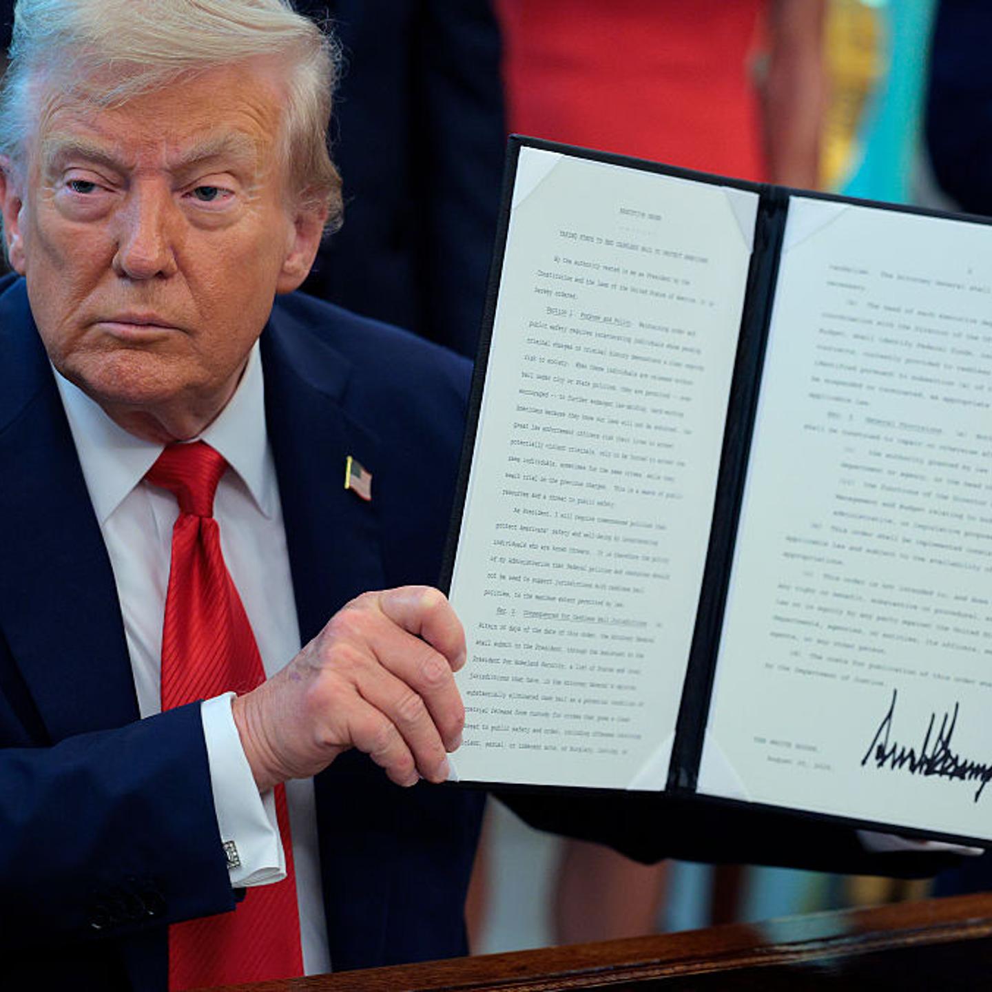 U.S. President Donald Trump signs executive orders in the Oval Office at the White House in Washington, D.C. on Aug. 25, 2025.