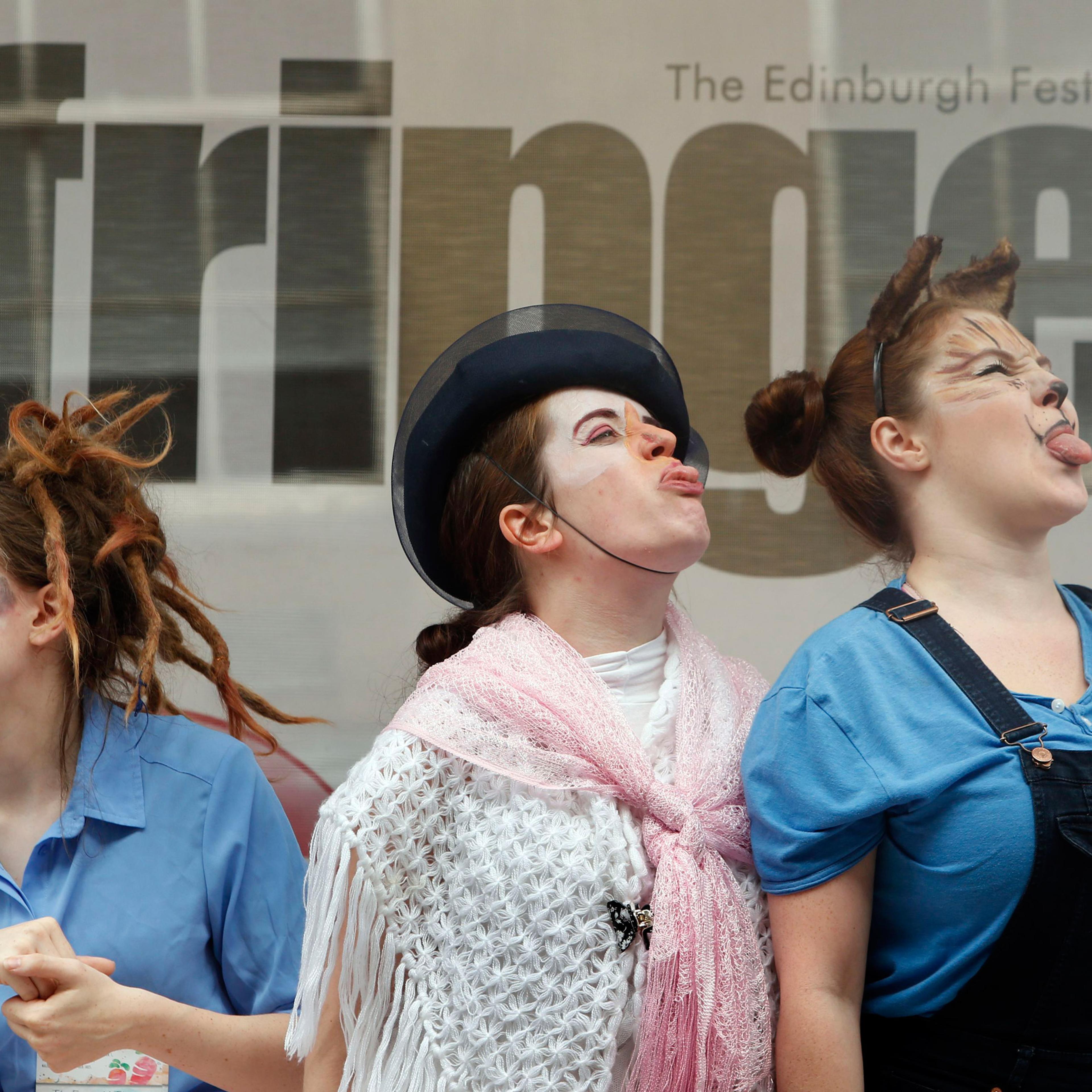 Edinburgh Fringe Festival 2015. Performers from The Emerald Theatre promote their Edinburgh Festival Fringe show on the Royal Mile in Edinburgh. Picture date: Monday August 24, 2015. The Edinburgh Festival Fringe is the largest arts festival in the world