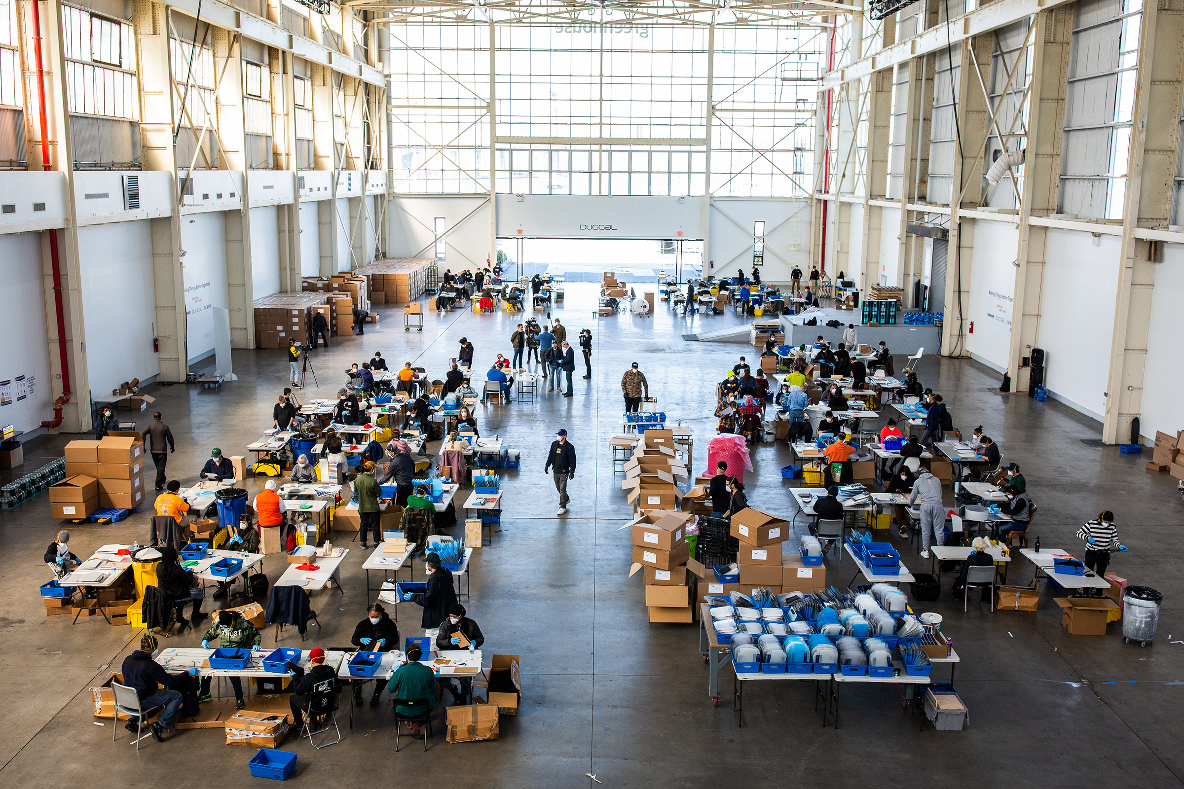 Workers assemble protective masks at Duggal Greenhouse in the Brooklyn, New York, on Thursday, March 26.
