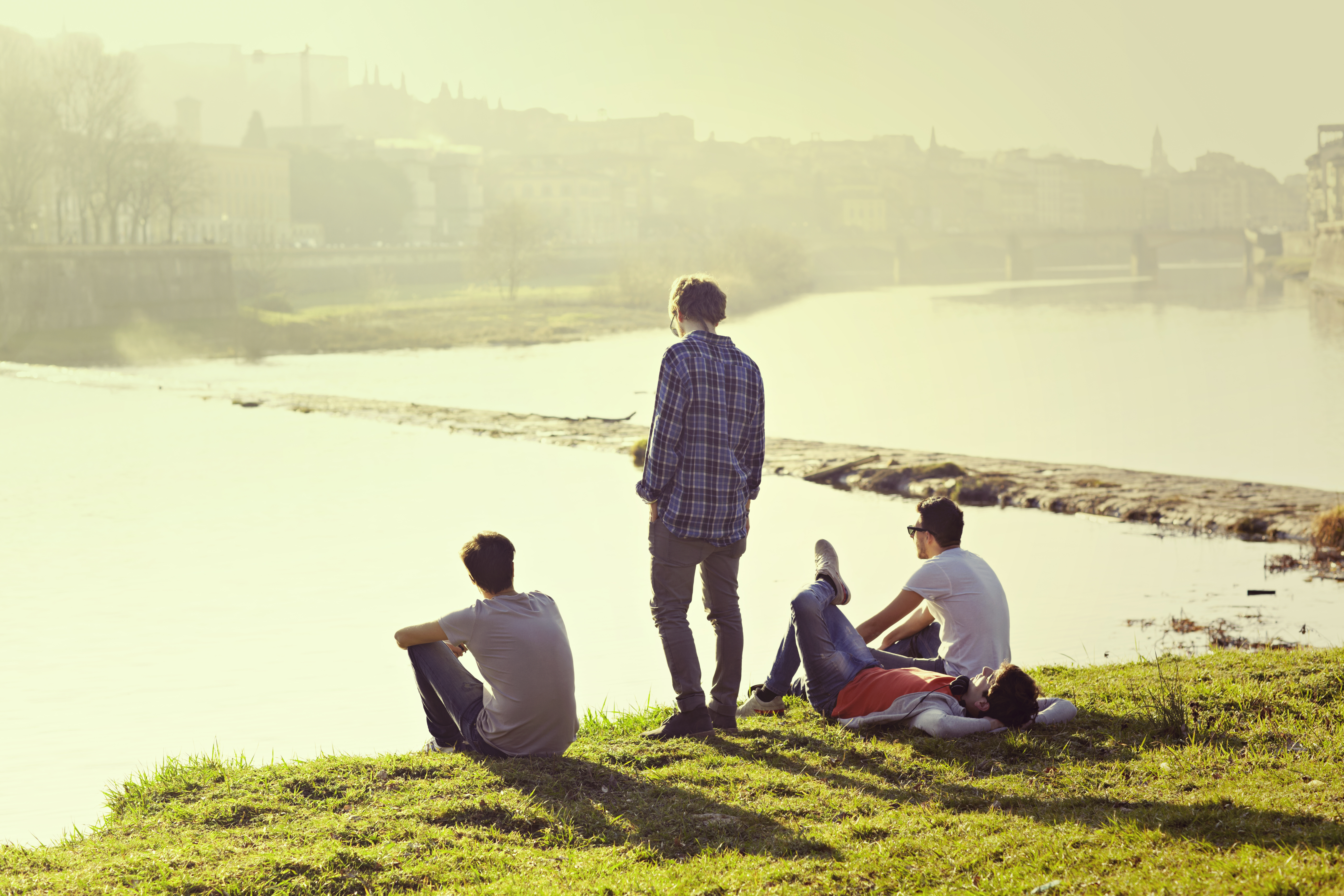 friends-sitting-river