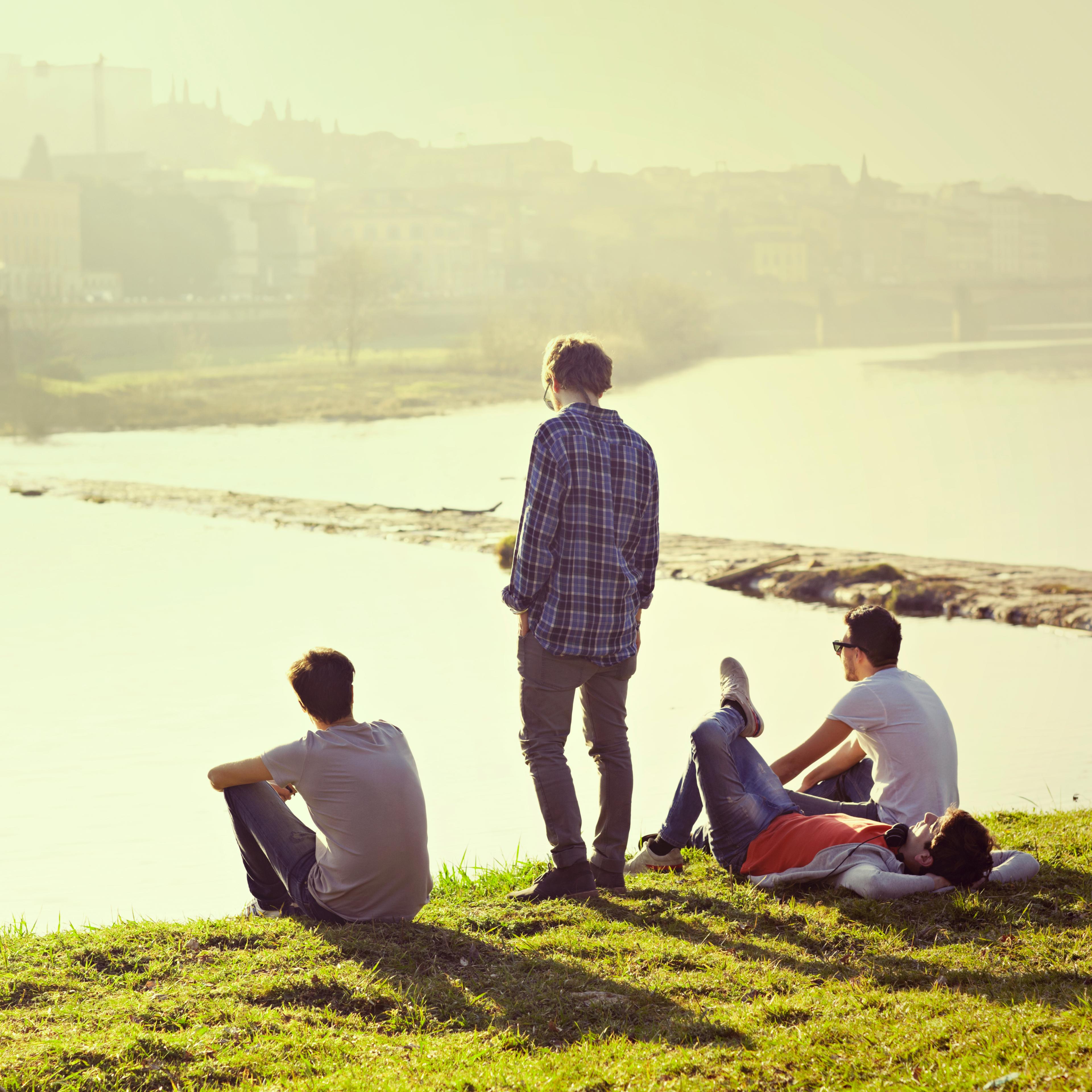 friends-sitting-river