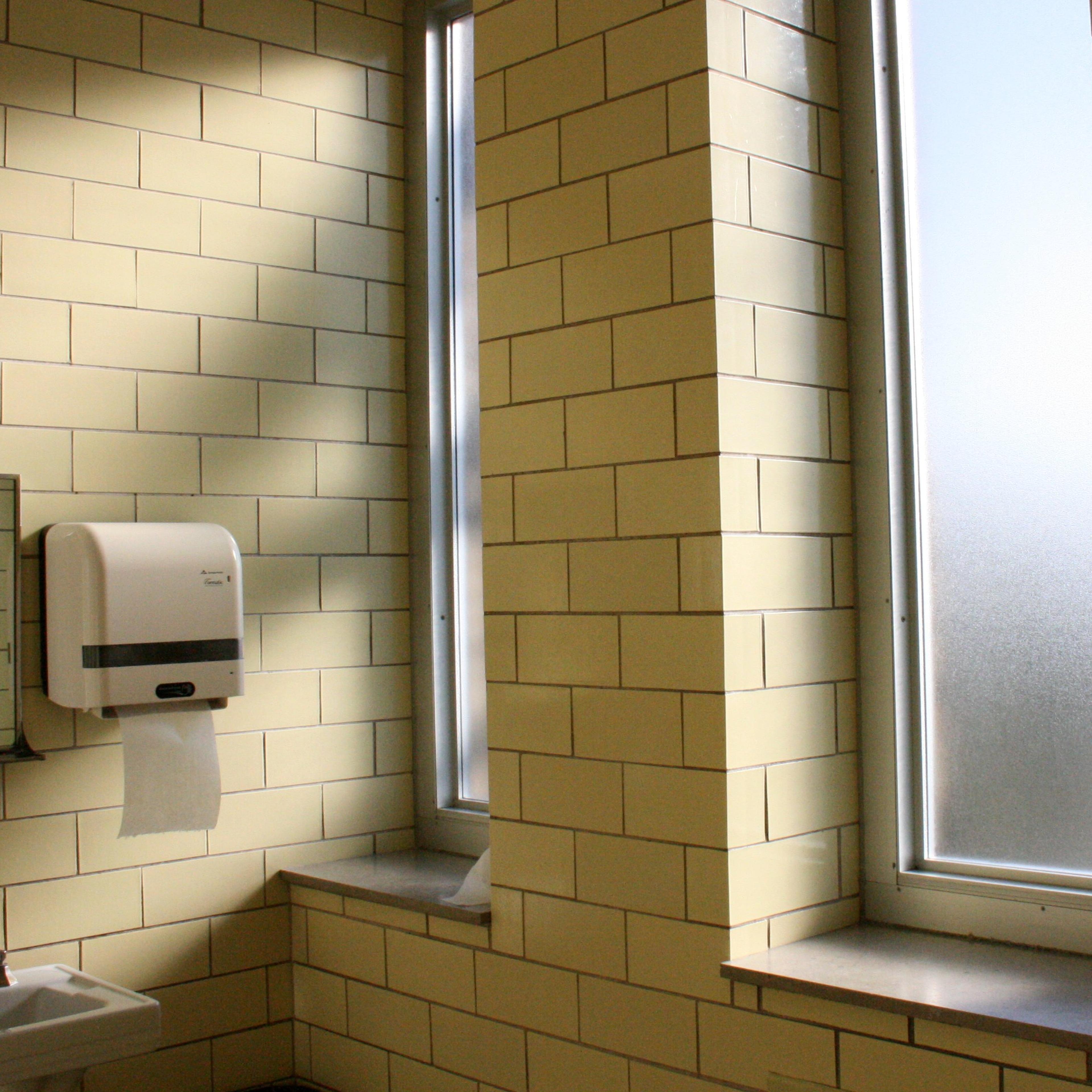 teacher leaves gun bathroom resigns