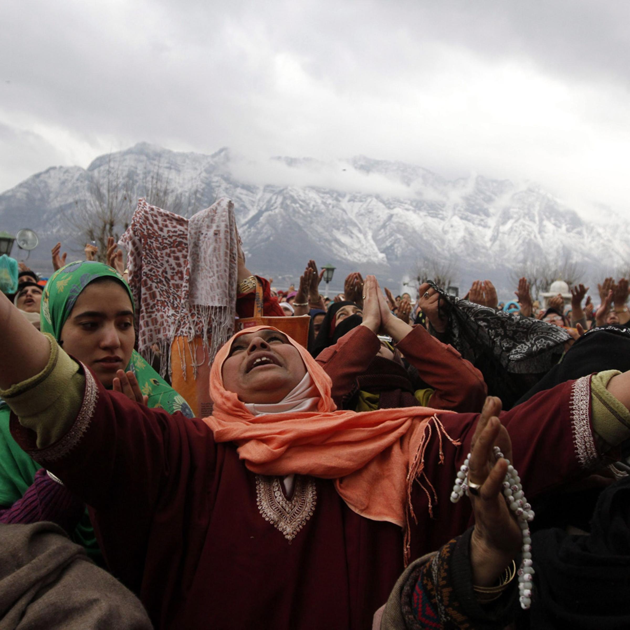February 5, 2012. Kashmiri Muslim devotees raise their hands for prayers as a head priest displays a relic of Prophet Mohammed at the Hazratbal shrine on the occasion of Eid-e-Milad, or birthday of Prophet Mohammed, in Srinagar, India.