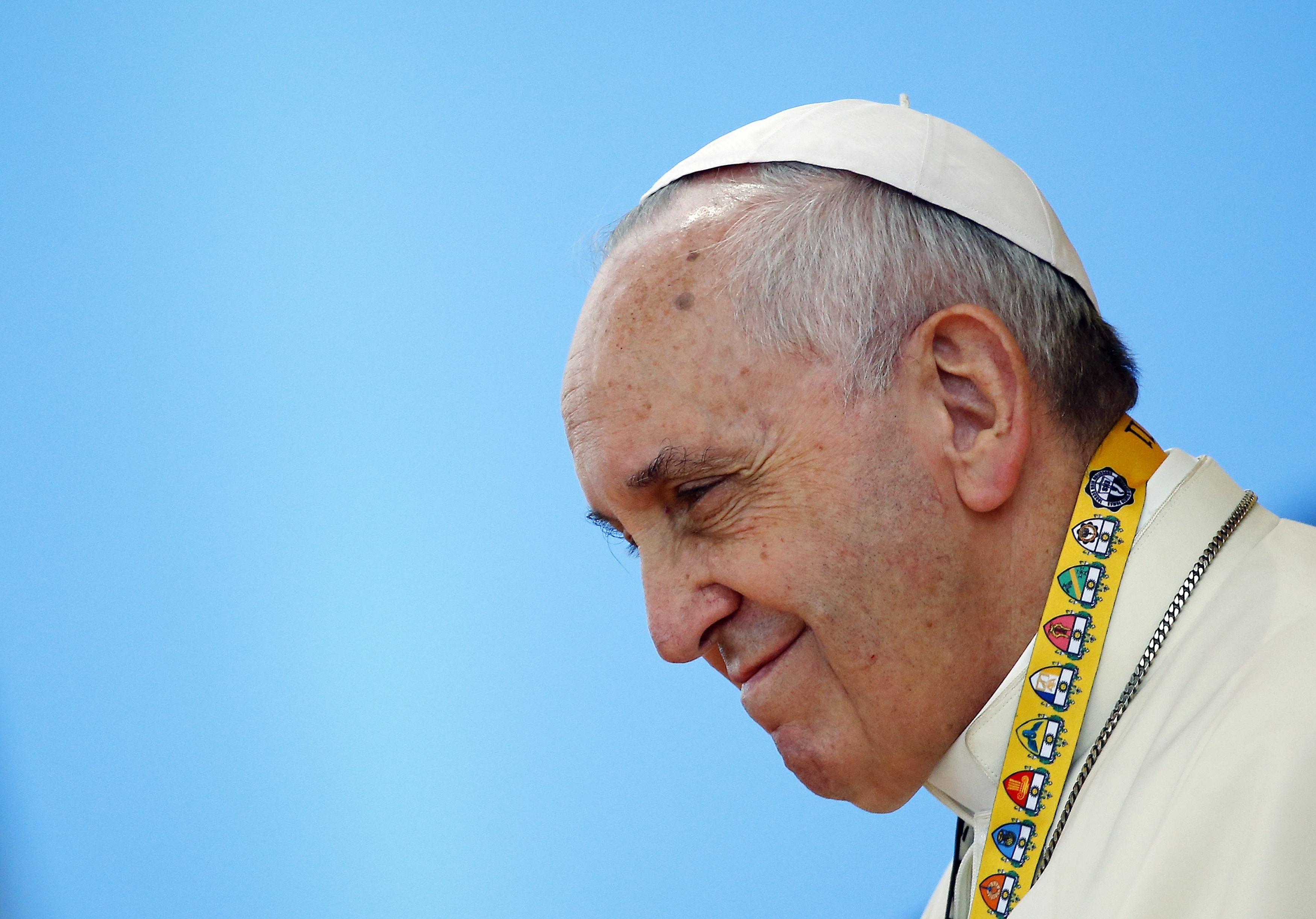 Pope Francis smiles during a meeting with young people at Manila university