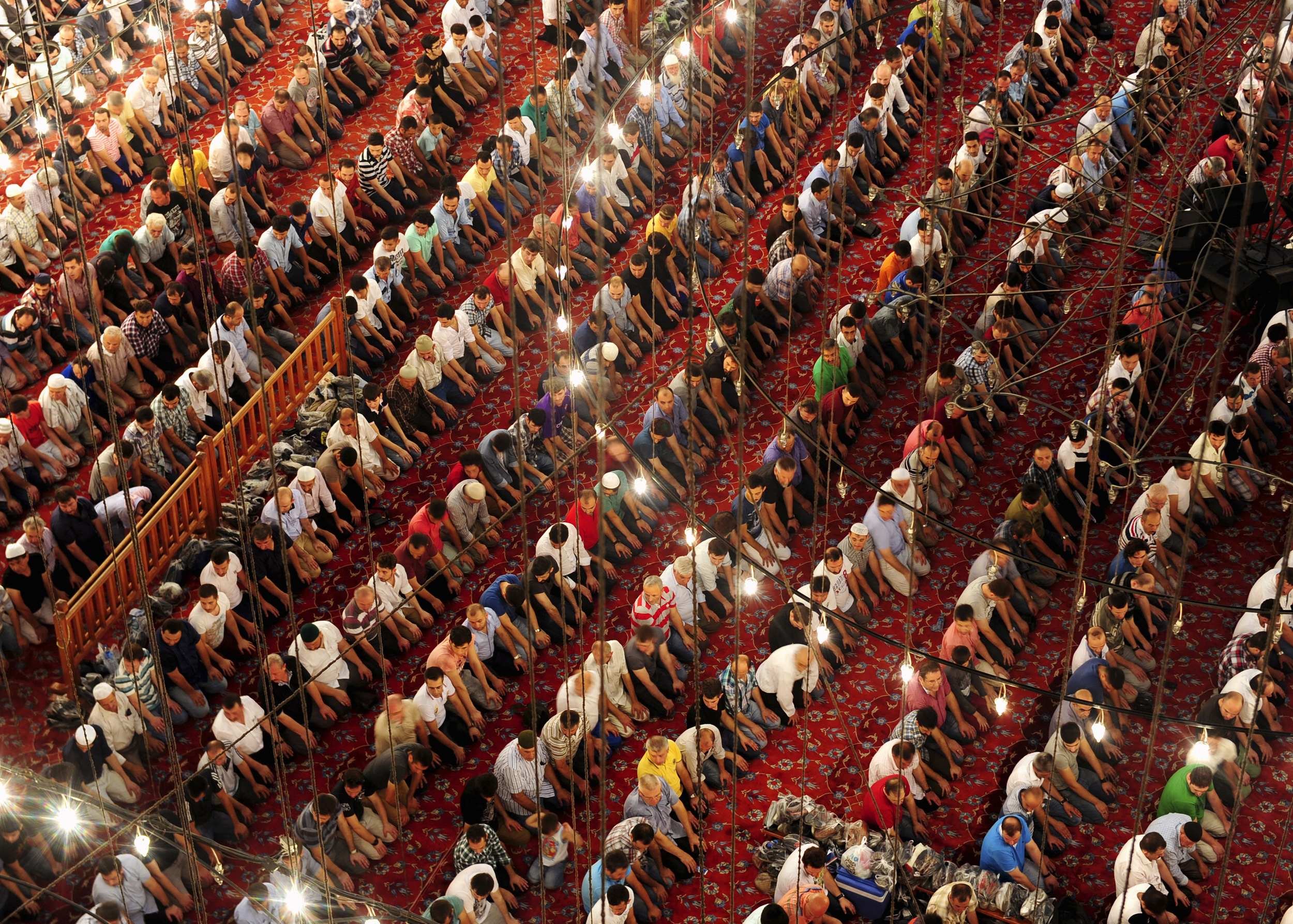 Turkish faithful pray in Ottoman-era Sultanahmet mosque, known as Blue mosque, on "Laylat Al Qadr" during the holy month of Ramadan, in Istanbul late July 23, 2014.