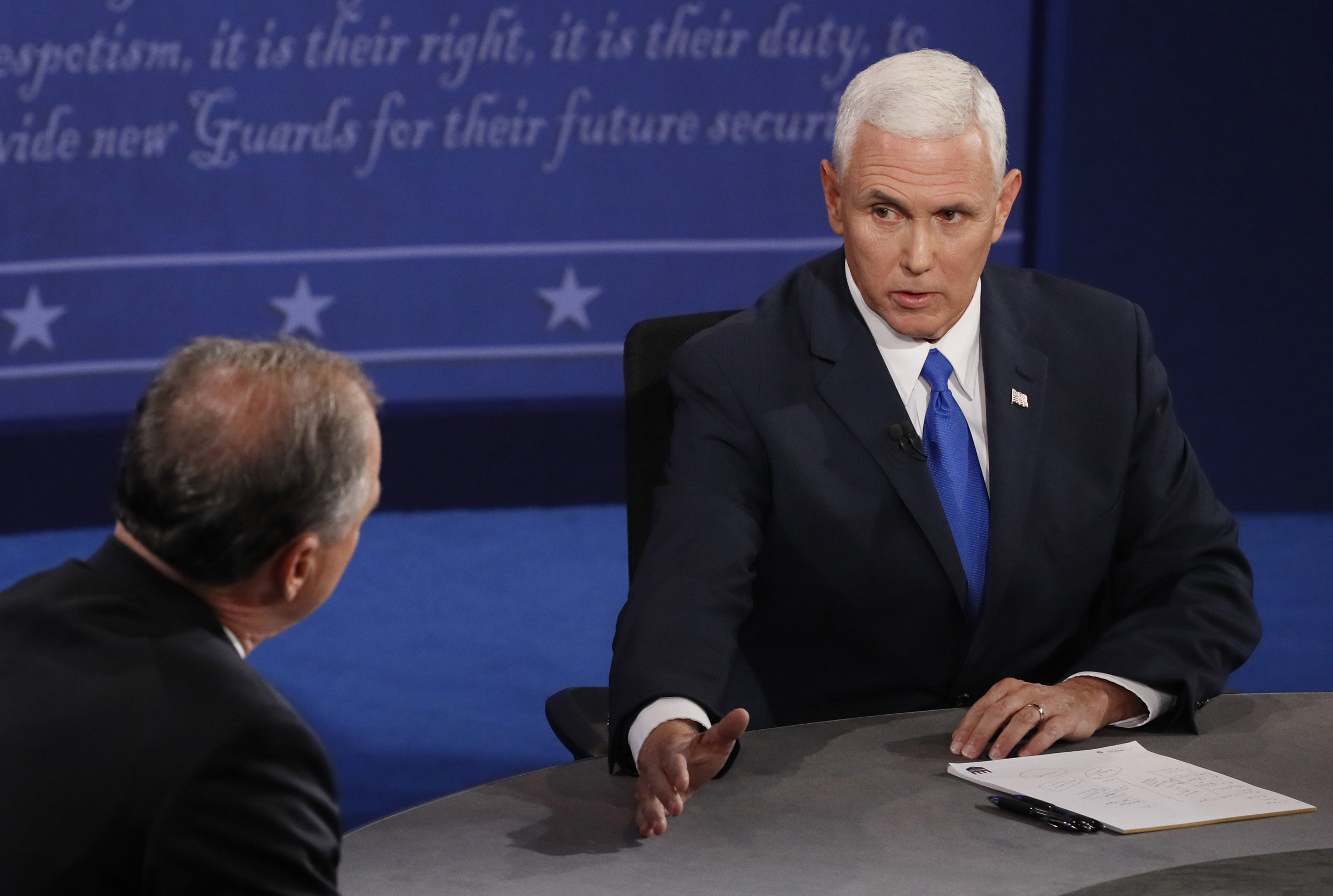 Democratic candidate for Vice President Tim Kaine (L) exchanges with Republican candidate for Vice President Mike Pence (R) during the first vice presidential debate at Longwood University in Farmville, Virginia, on Oct. 4, 2016.