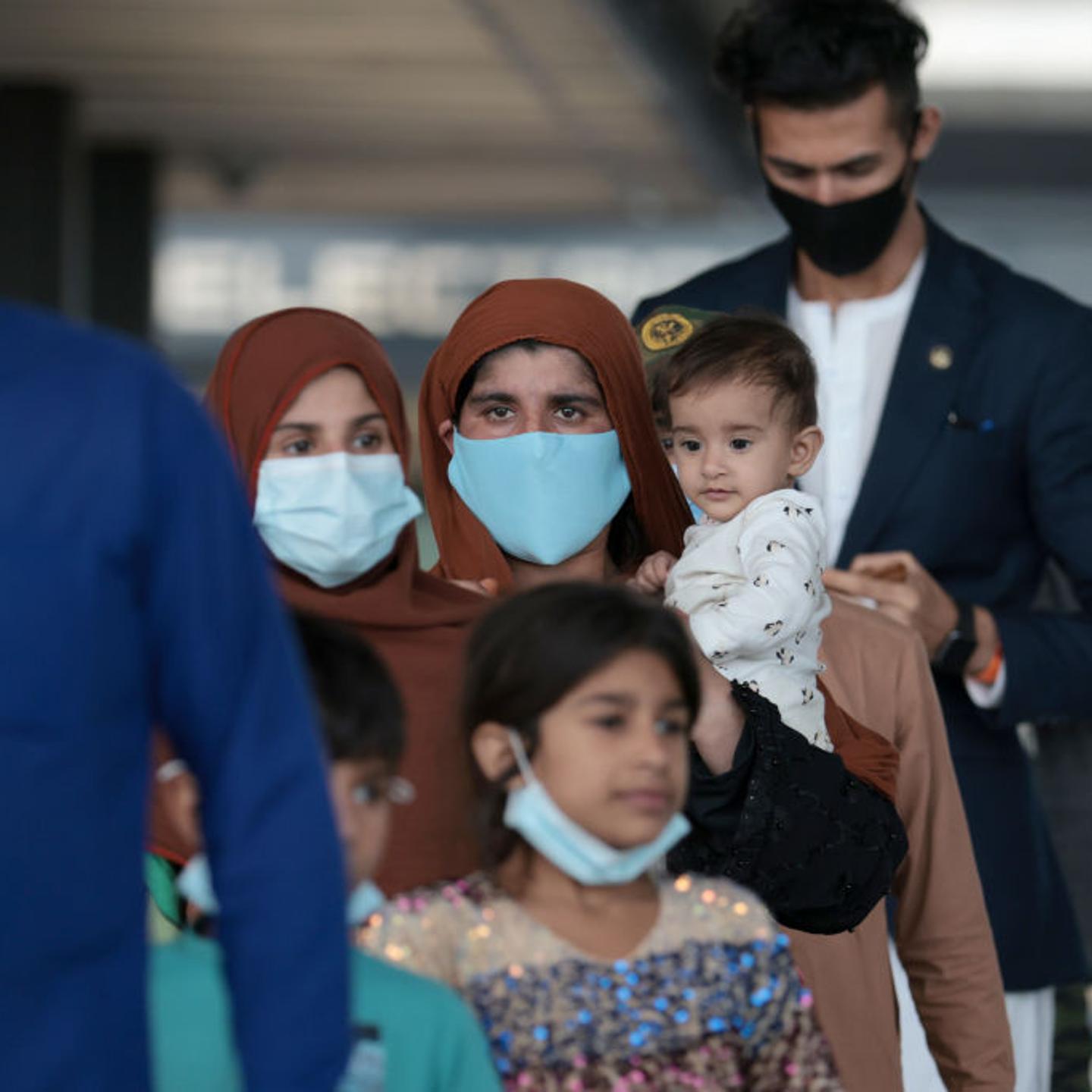 Afghan Refugees Arrive At Dulles Airport After US Pulls Out Final Troops