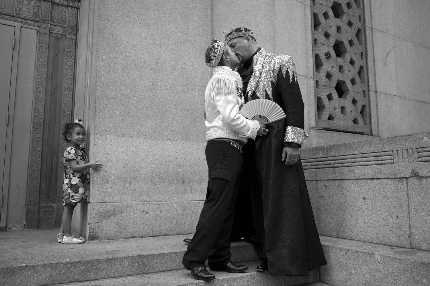 Damian Ross (left) and Gary Cosgrove embrace on the steps of the Manhattan City Clerk's office while waiting in line on July 24, 2011.