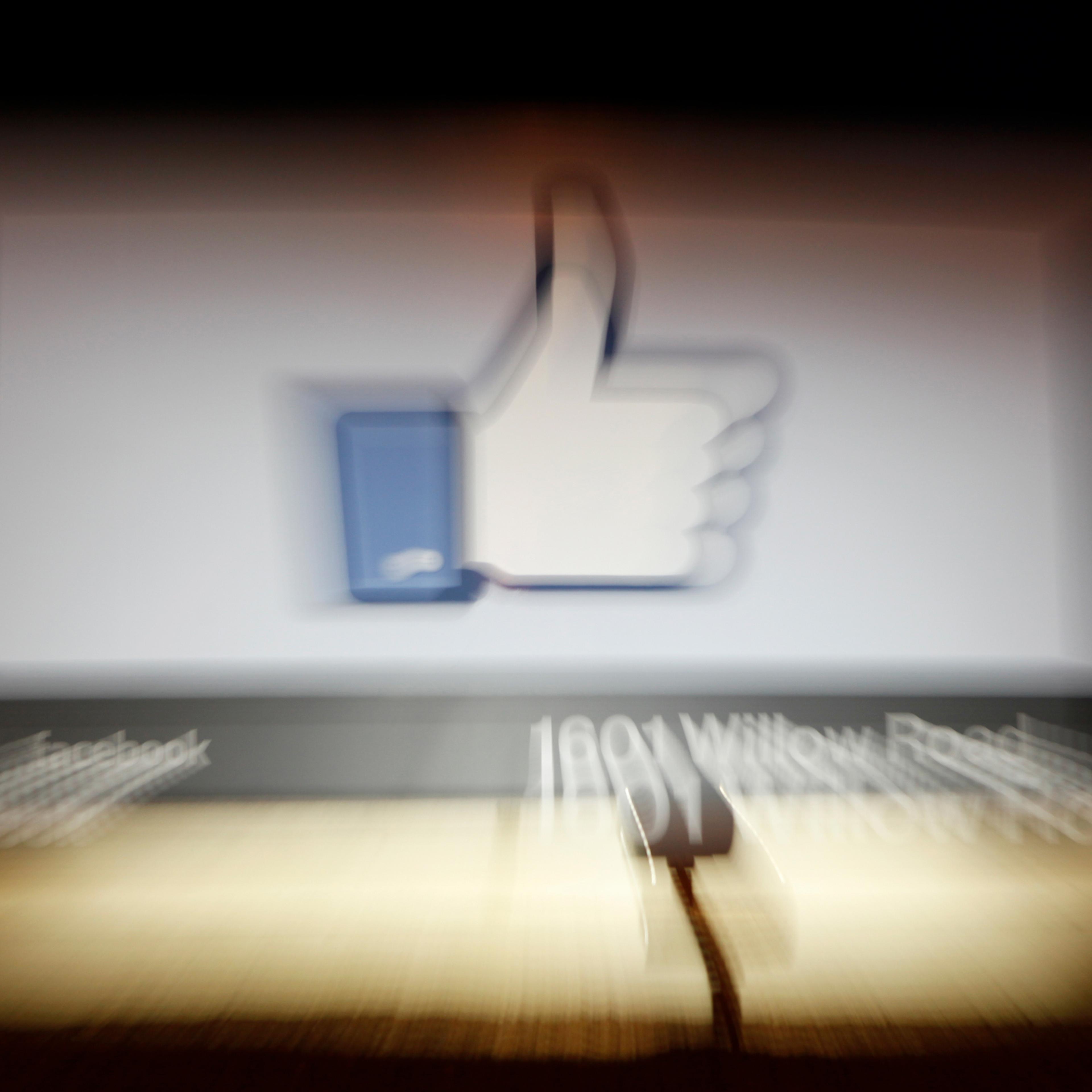 A Facebook Like Button logo is seen at the entrance of the Facebook headquarters in Menlo Park, Calif., on May 10, 2012.