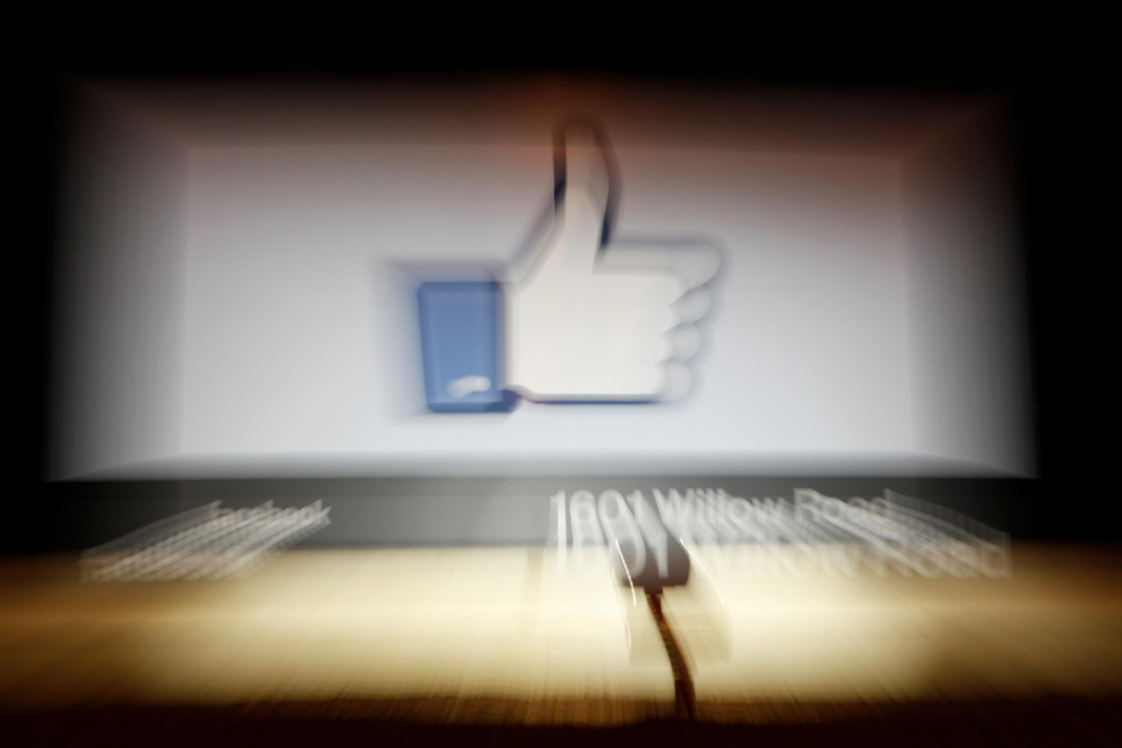 A Facebook Like Button logo is seen at the entrance of the Facebook headquarters in Menlo Park, Calif., on May 10, 2012.