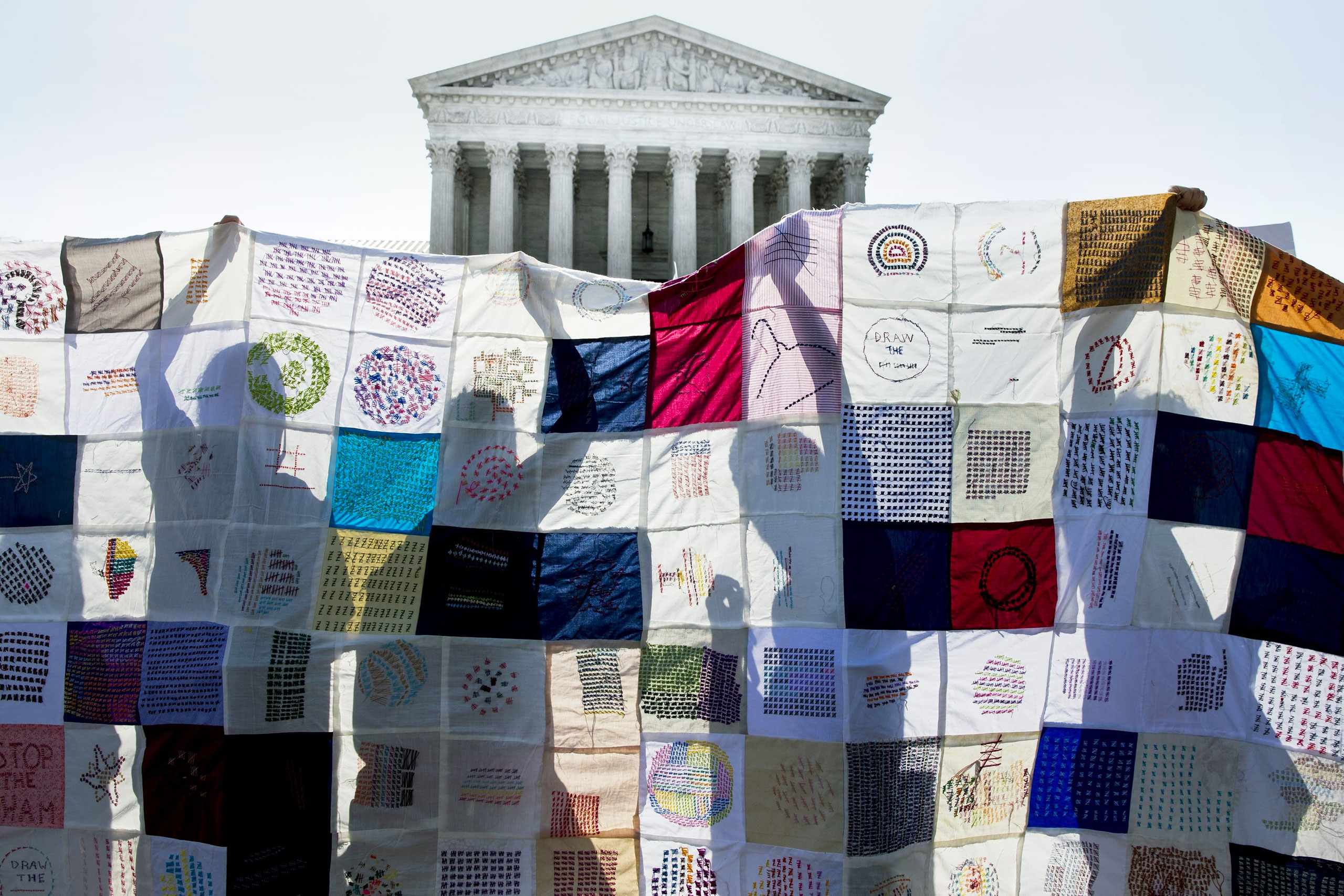 Pro-choice activists rally outside the court June 27 after it ruled against a Texas abortion law