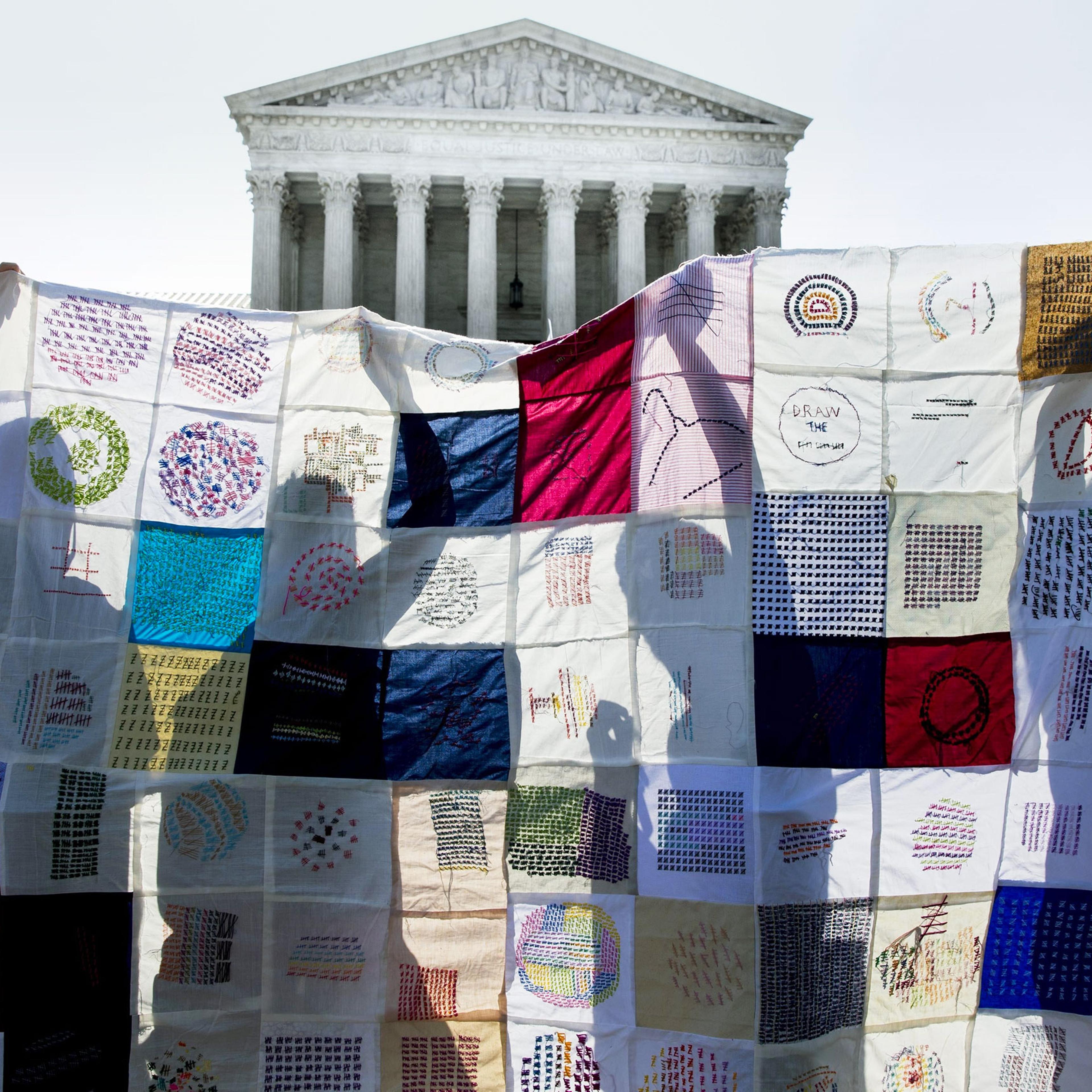 Pro-choice activists rally outside the court June 27 after it ruled against a Texas abortion law