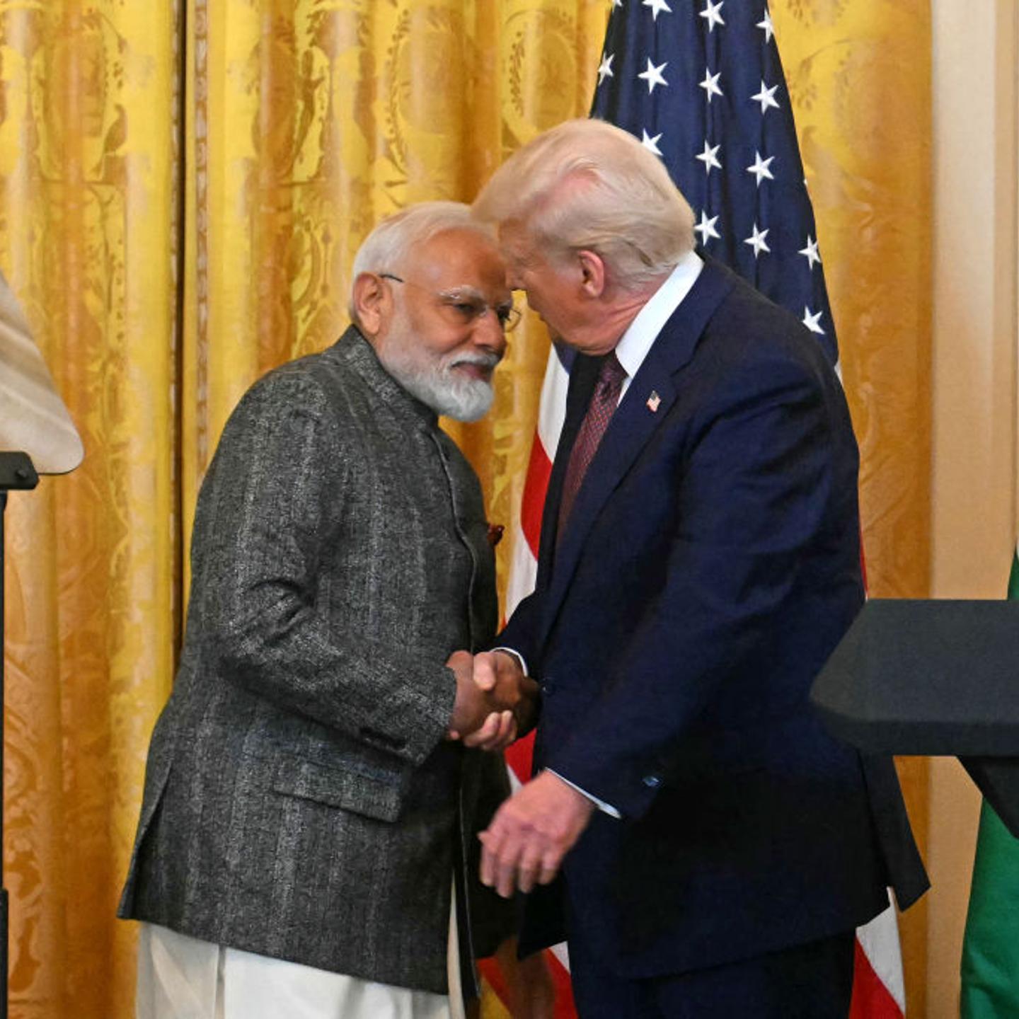 President Donald Trump shakes hands with Indian Prime Minister Narendra Modi