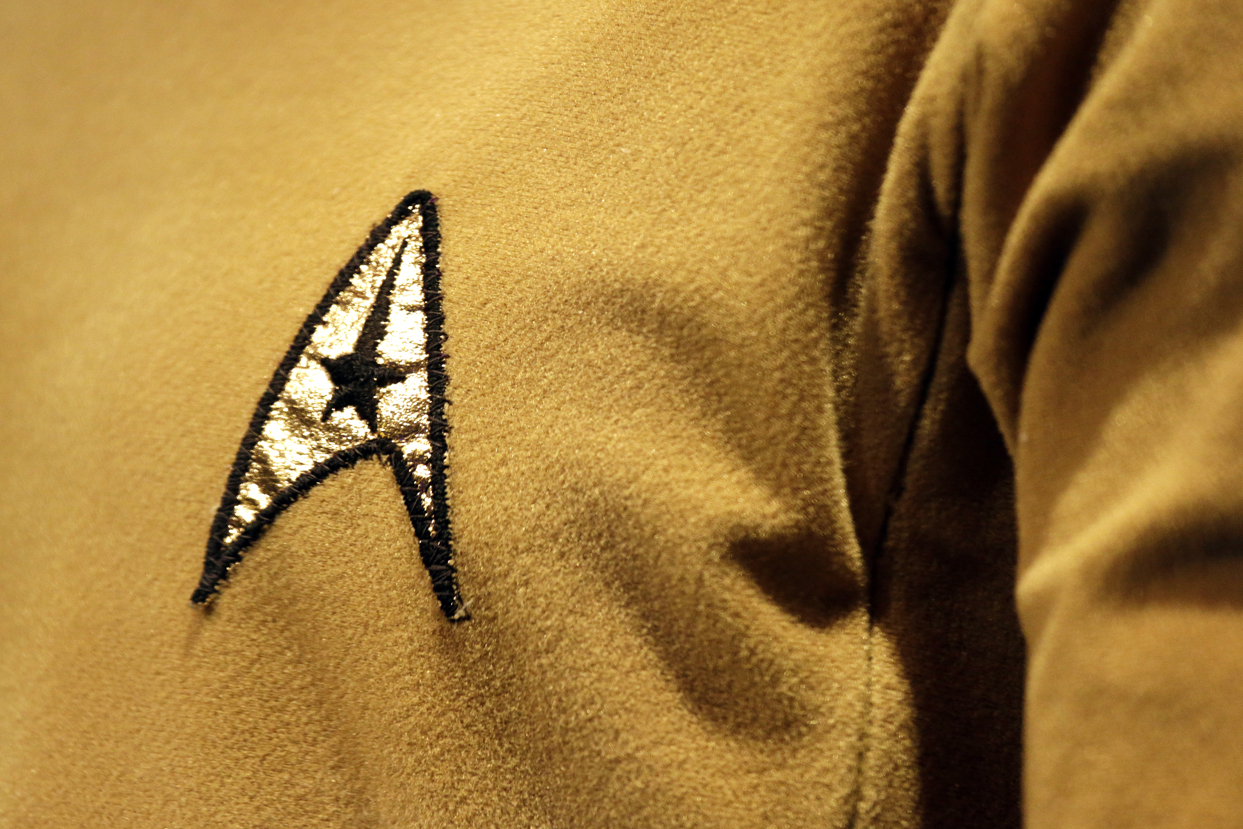 A Starfleet insignia appears on the original tunic worn by Capt. James T. Kirk, played by William Shatner at the EMP Museum, in Seattle, May 18, 2016.