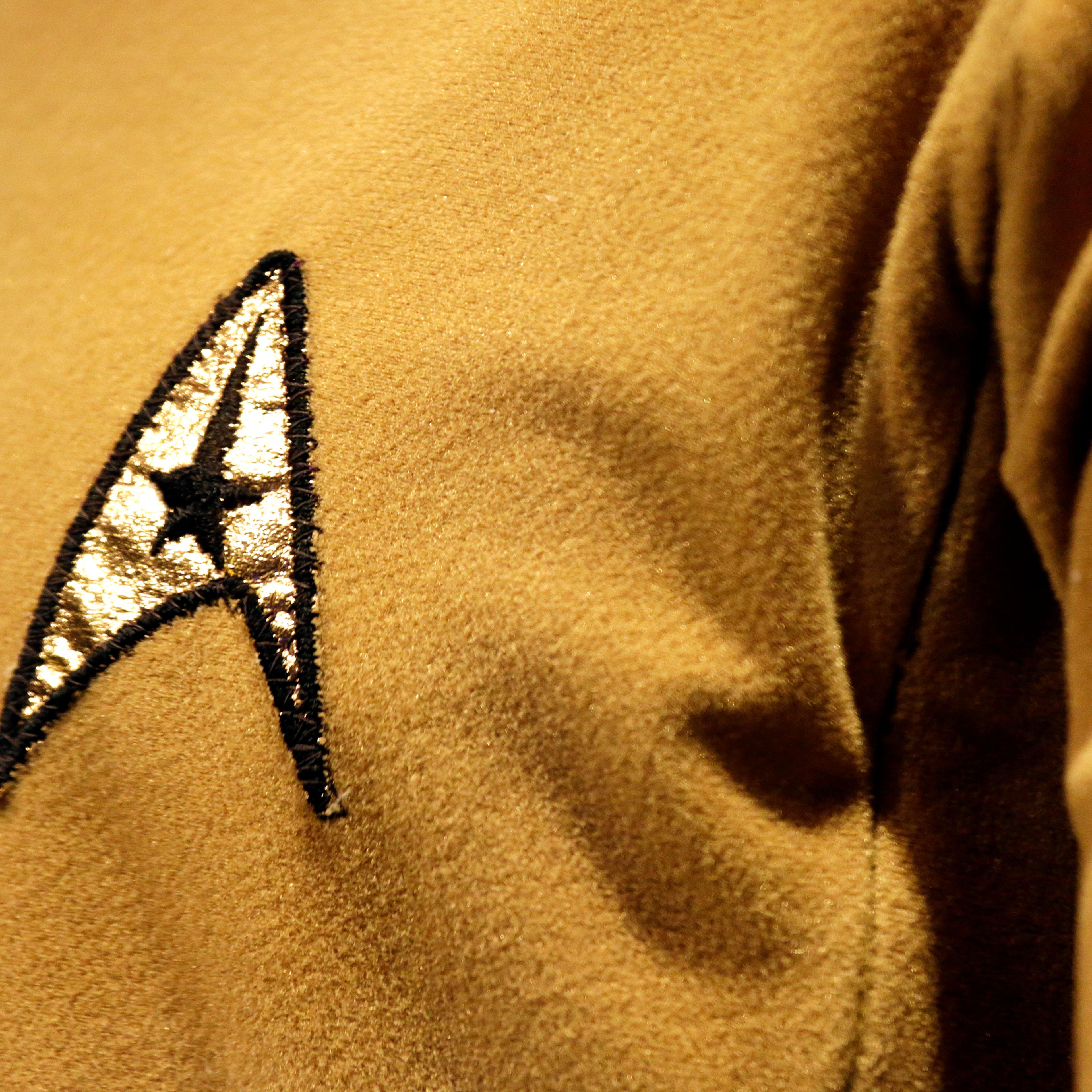 A Starfleet insignia appears on the original tunic worn by Capt. James T. Kirk, played by William Shatner at the EMP Museum, in Seattle, May 18, 2016.