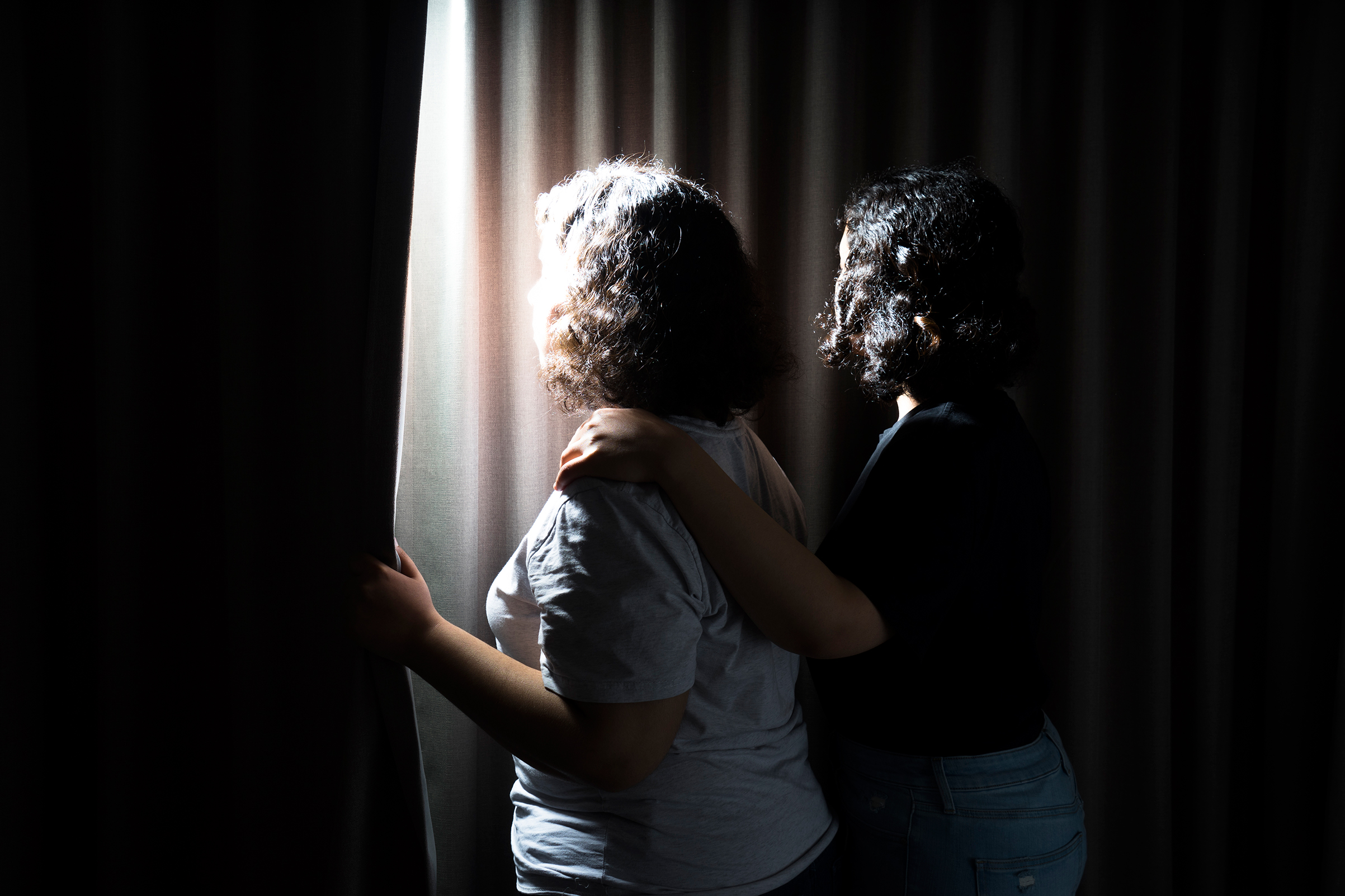 Rawan (left) and her elder sister Reem stand for a photograph in a room in Hong Kong on February 25th, 2019. Reem, aged 18, and Rawan (aged 20) (not their real names) fled from their abusive family and Saudi Arabia's oppressive conditions while on holida