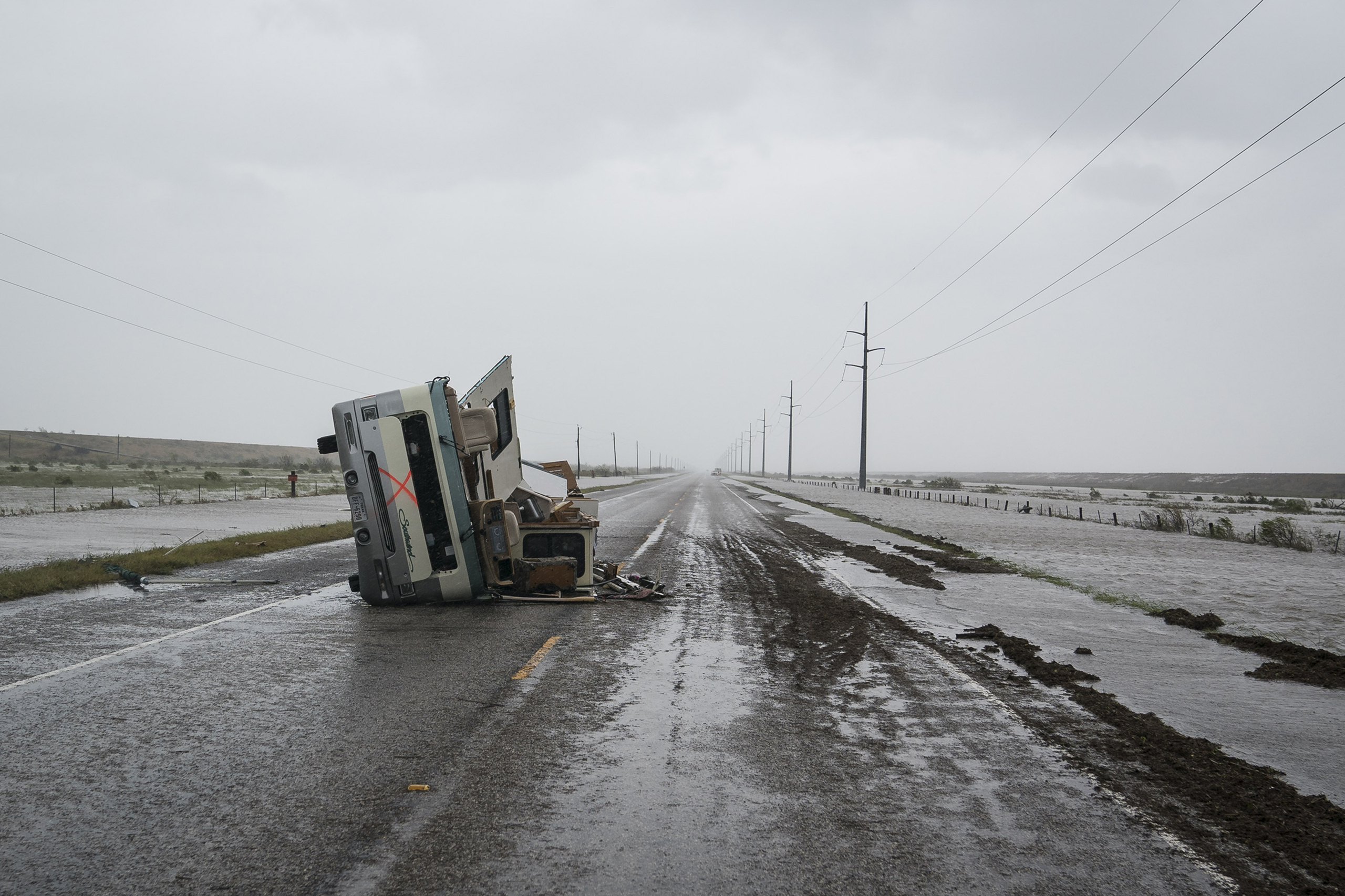 An RV is seen destroyed along the road near City-By-The Sea, TX as Hurricane Harvey hits the Texas coast on Aug 26, 2017.