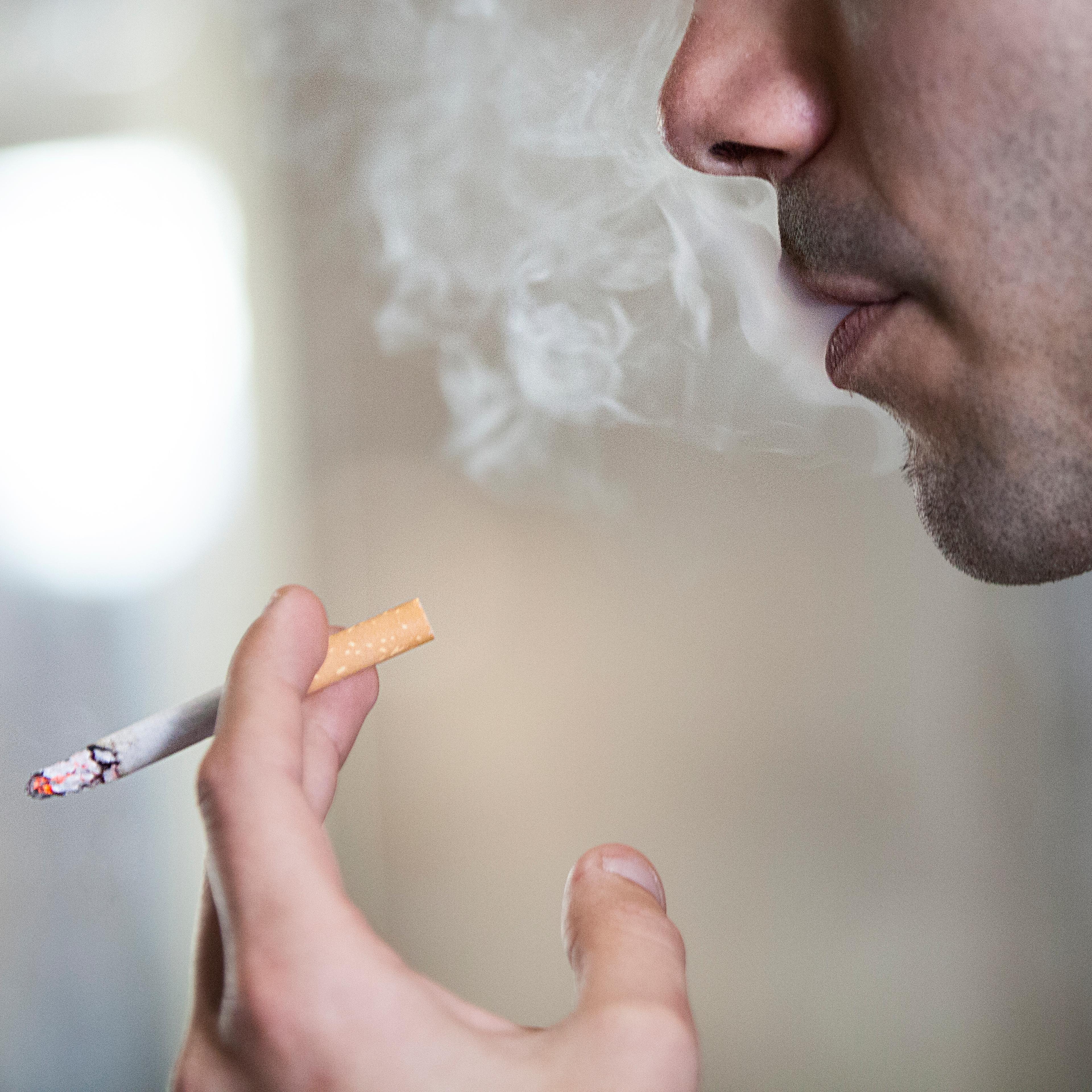 Man Smoking in Public Space