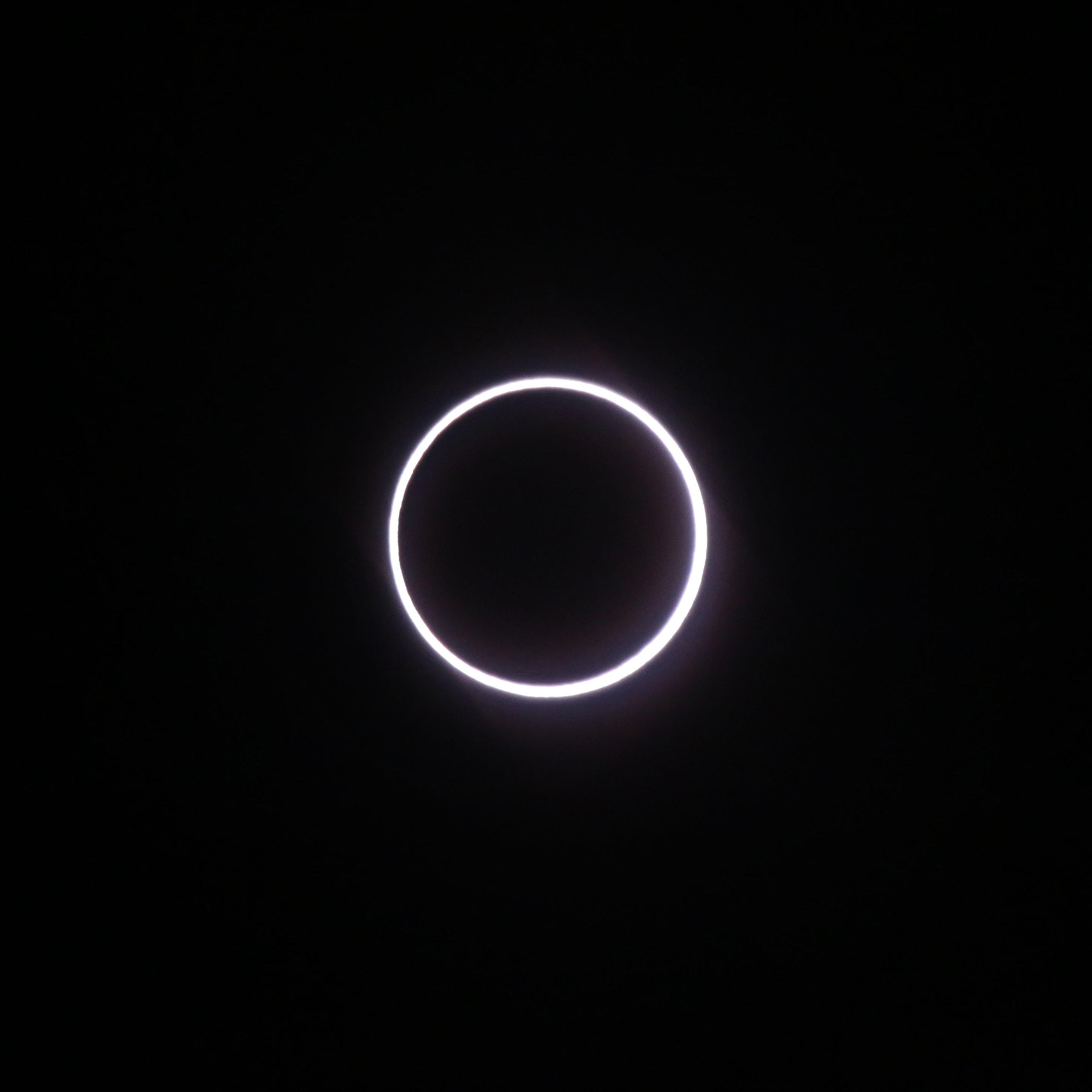 The moon covering the sun, leaving a ring of fire effect around the moon, during an annular solar eclipse over Saint-Louis, on the Indian Ocean island of La Reunion, Sept. 1, 2016.