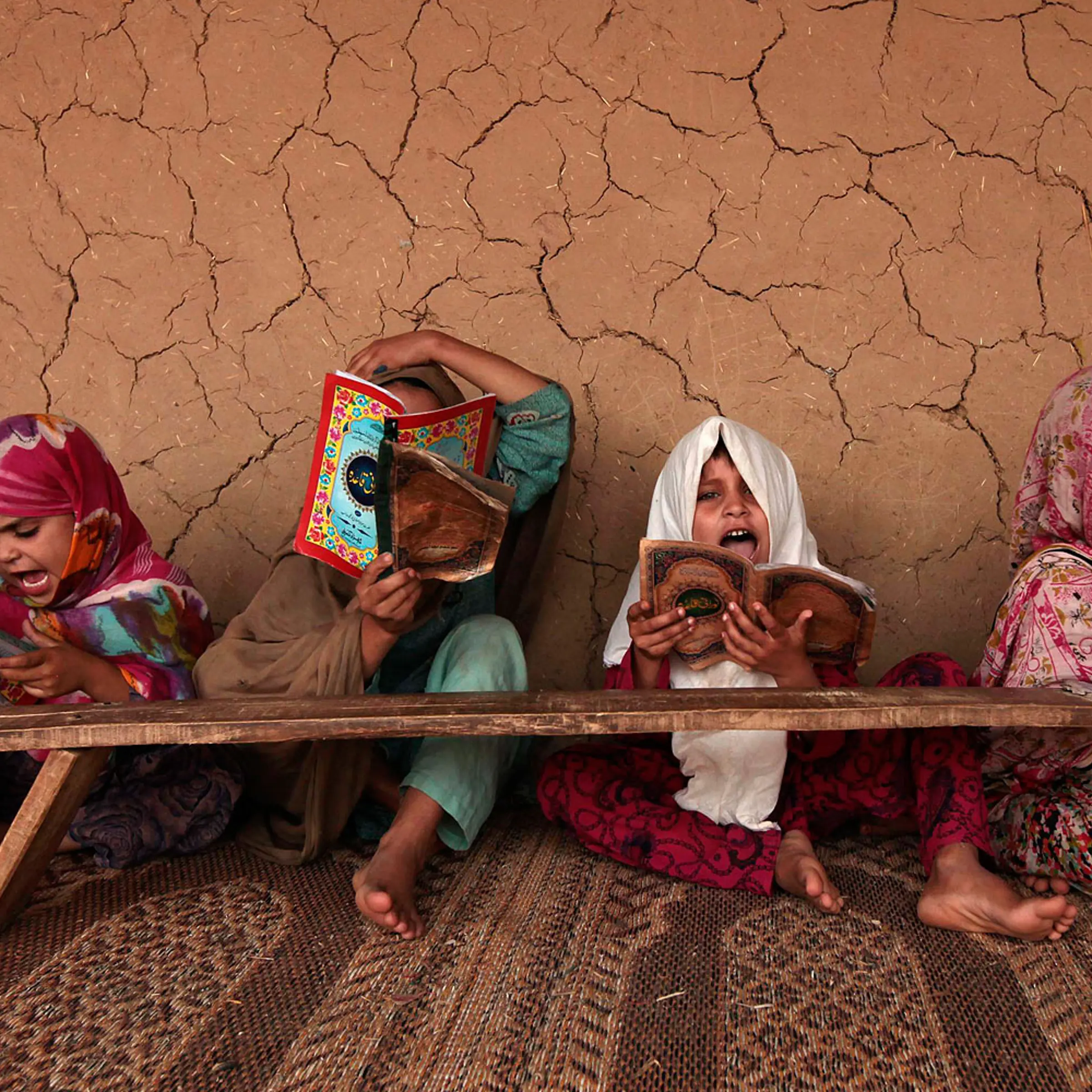 Girls read books containing short verses from the Koran in a madrasa, or religious school, on the outskirts of Islamabad.