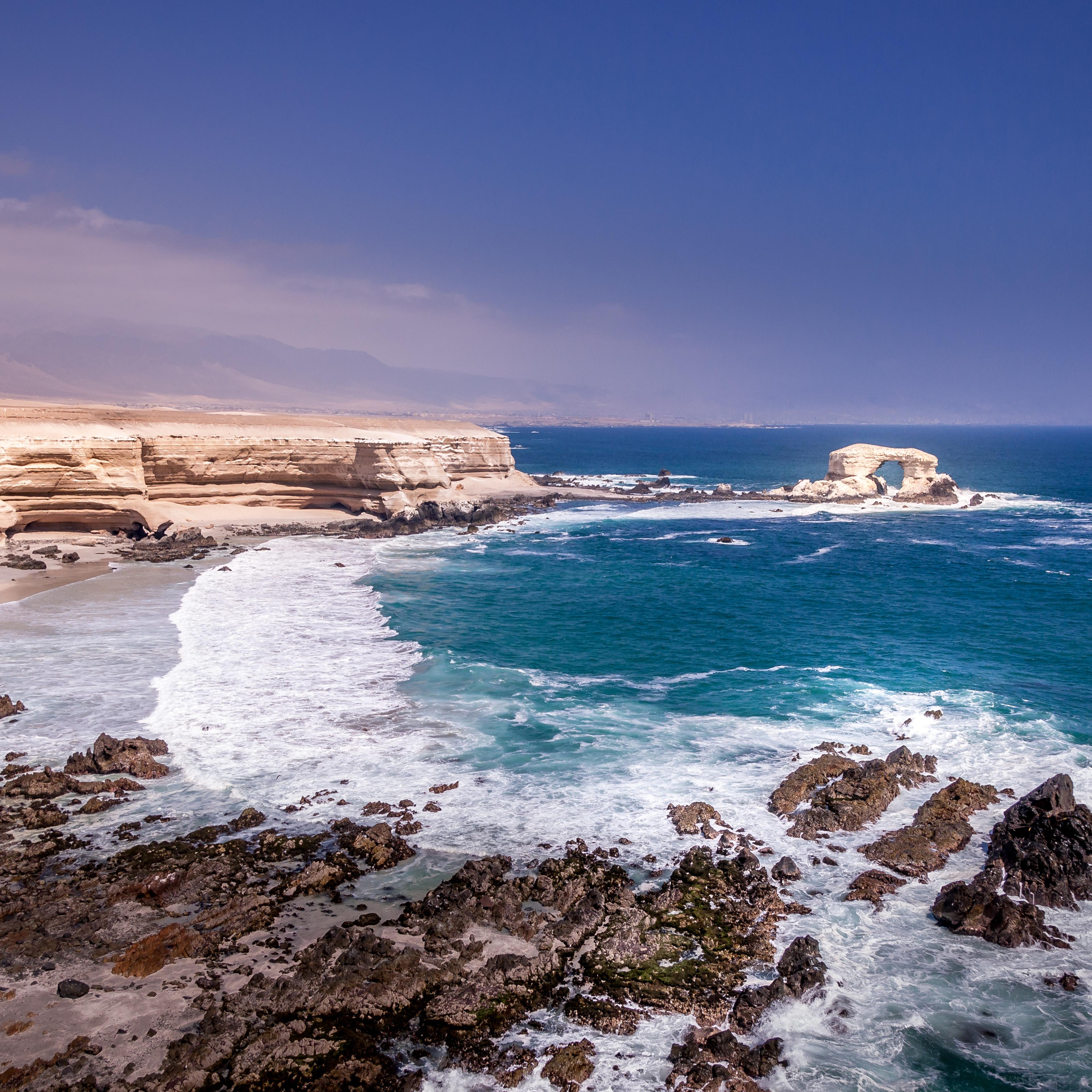 Scenic View Of Sea Against Blue Sky