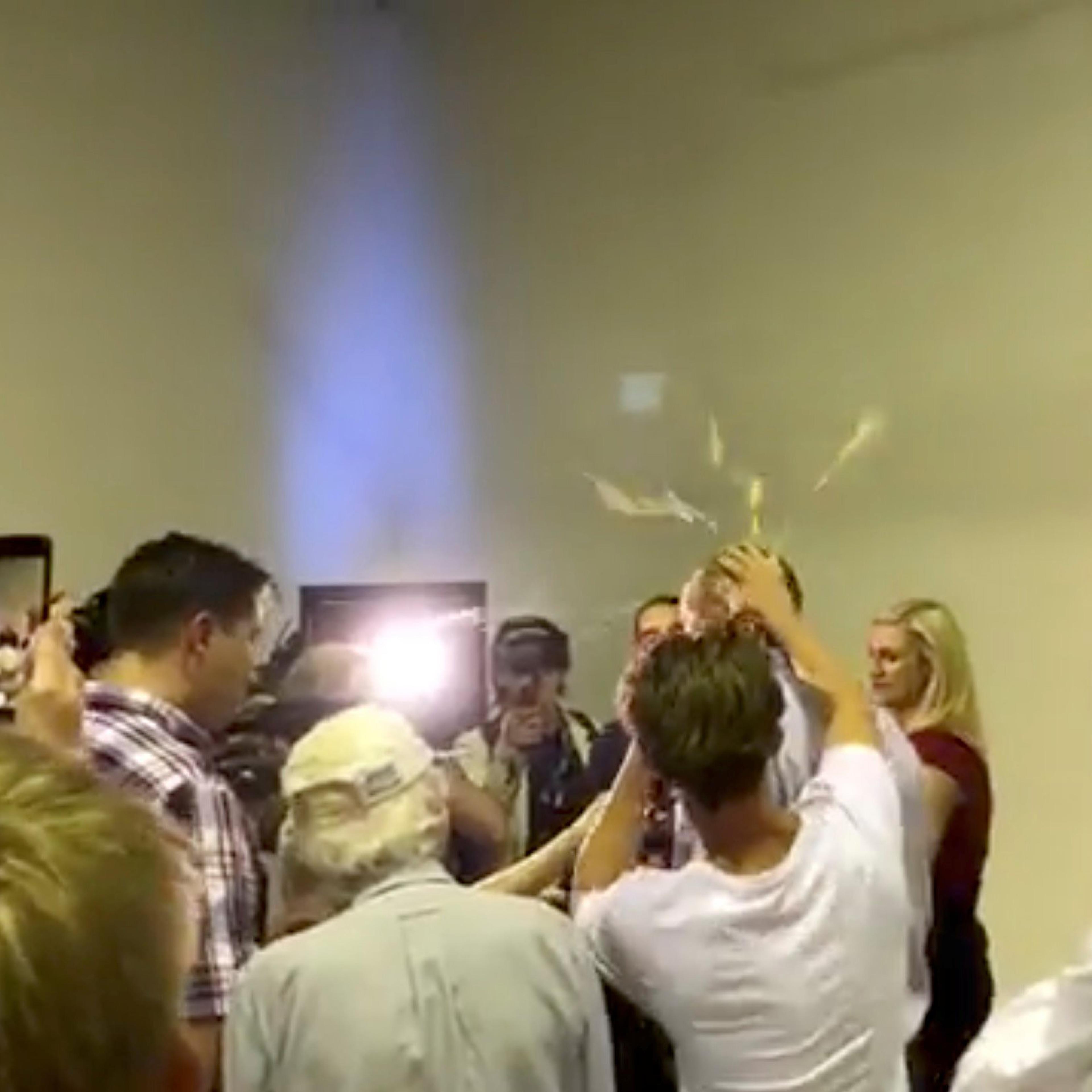 Australian Senator Fraser Anning has an egg smashed on his head while talking to the media in Victoria, Australia