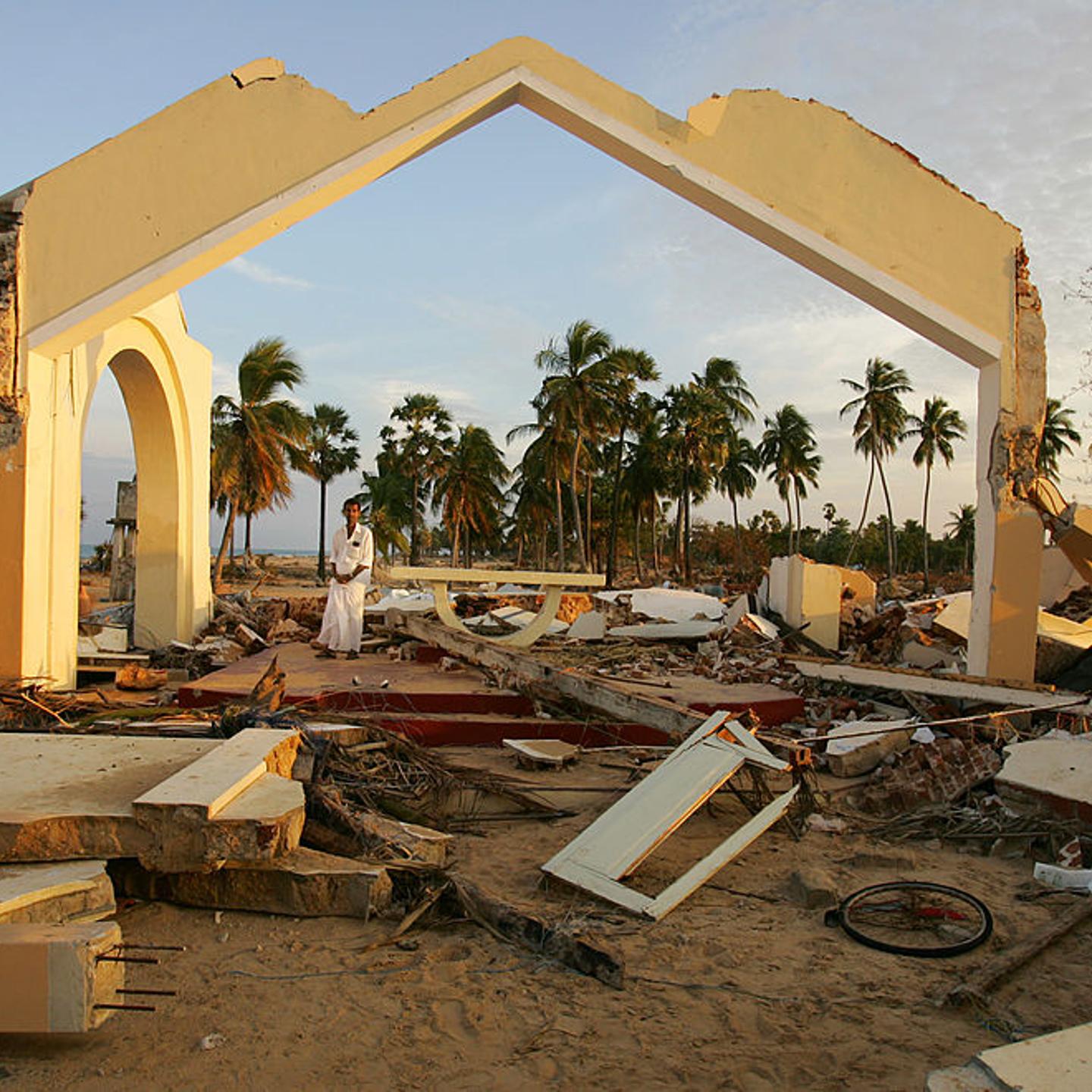A Tsunami earthquake survivor stands amongst the ruins of St.Peter's Church in the devastated town of Mullaitivu on Jan. 3, 2005 in Sri Lanka.