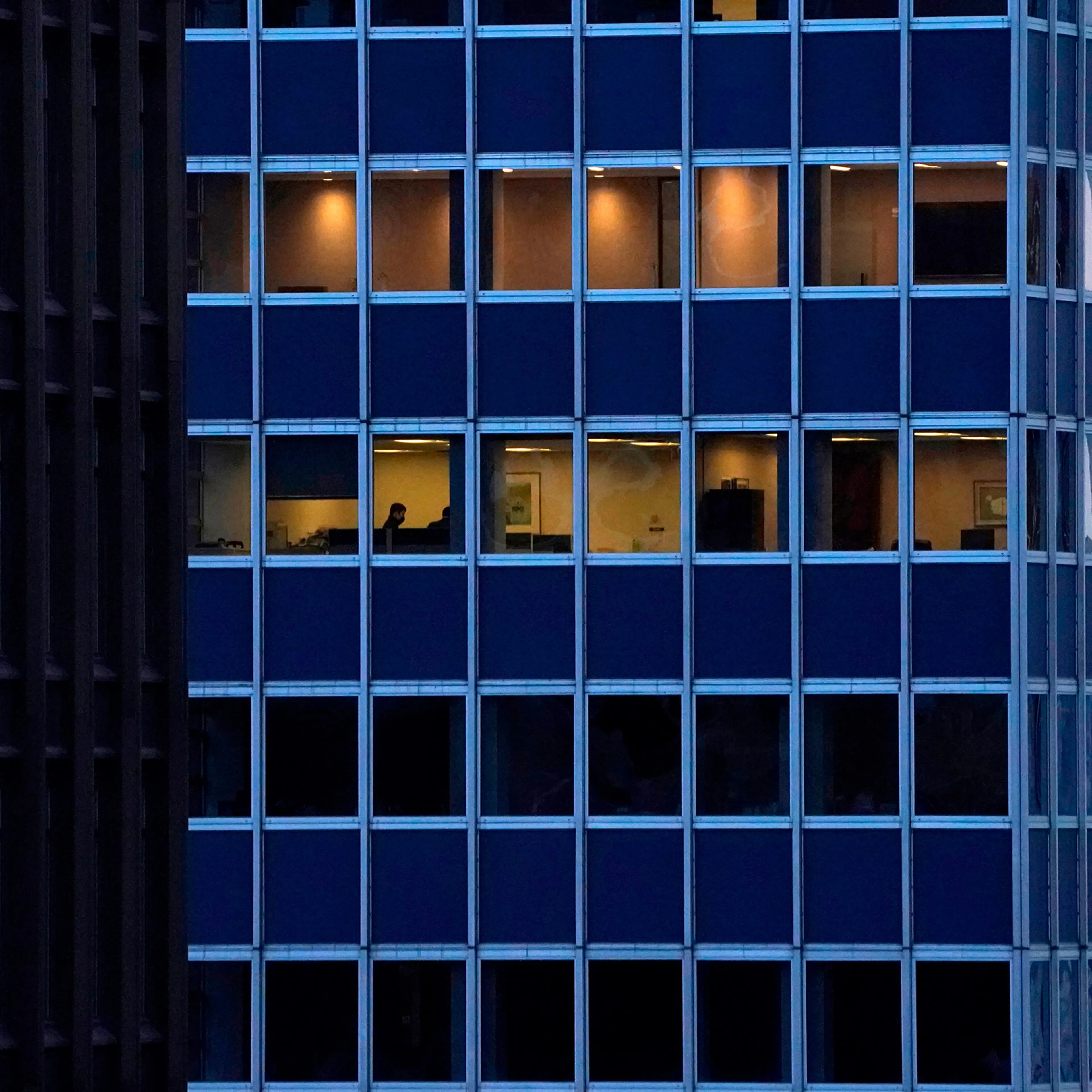 Employees work in an office building in Midtown, New York City, on Jan. 26.