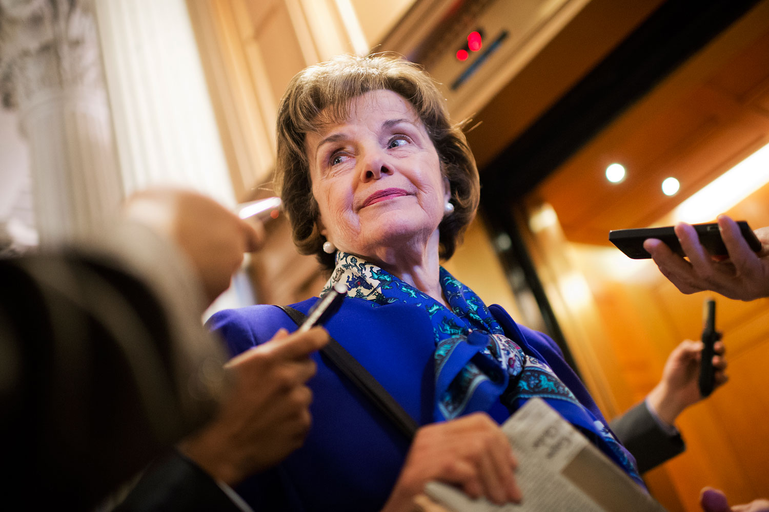 Sen. Dianne Feinstein, chairman of the Senate Intelligence Committee, speaks with reporters in the Capitol after a speech on the Senate floor that accused the CIA of searching computers set up for Congressional staff for their research of interrogation p