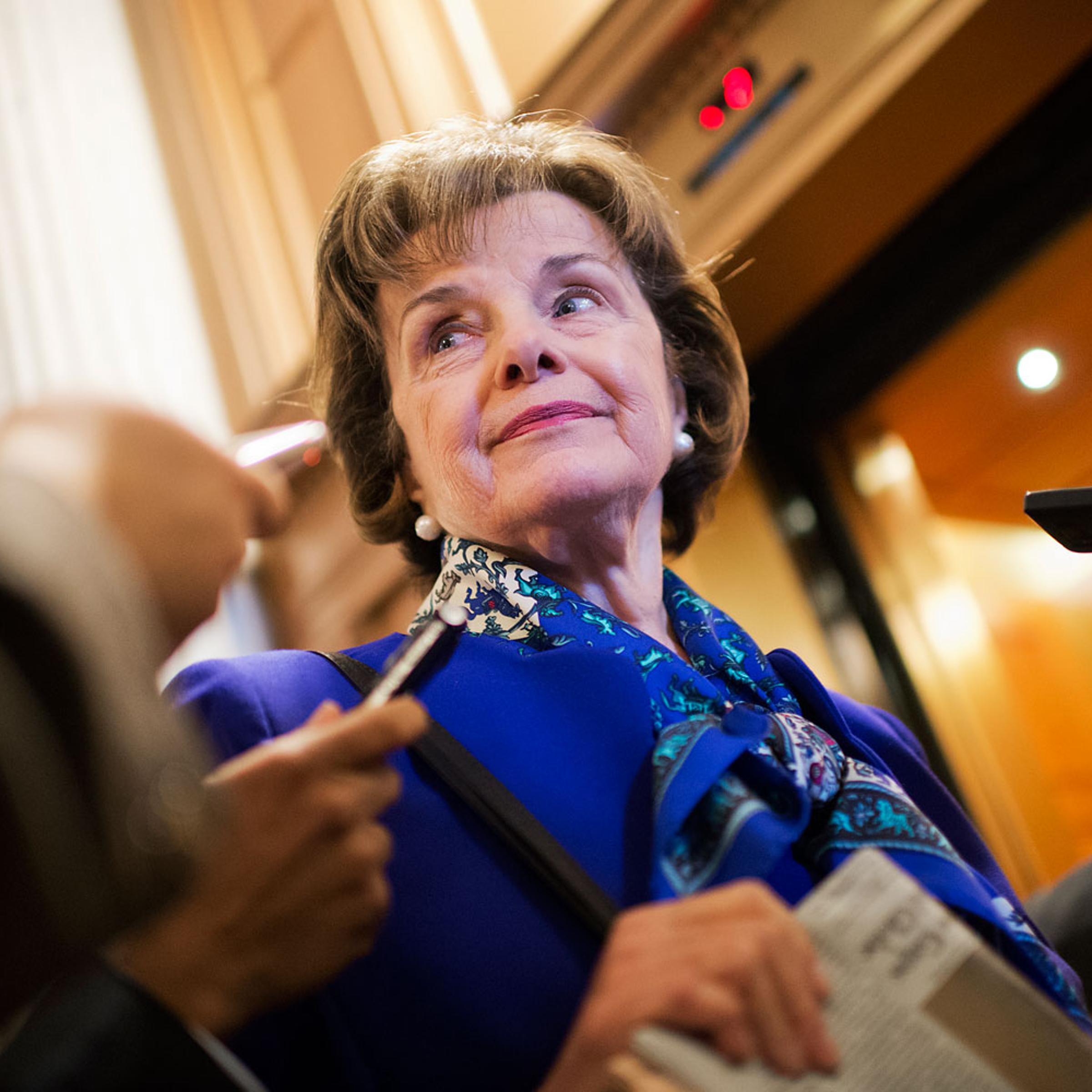Sen. Dianne Feinstein, chairman of the Senate Intelligence Committee, speaks with reporters in the Capitol after a speech on the Senate floor that accused the CIA of searching computers set up for Congressional staff for their research of interrogation p