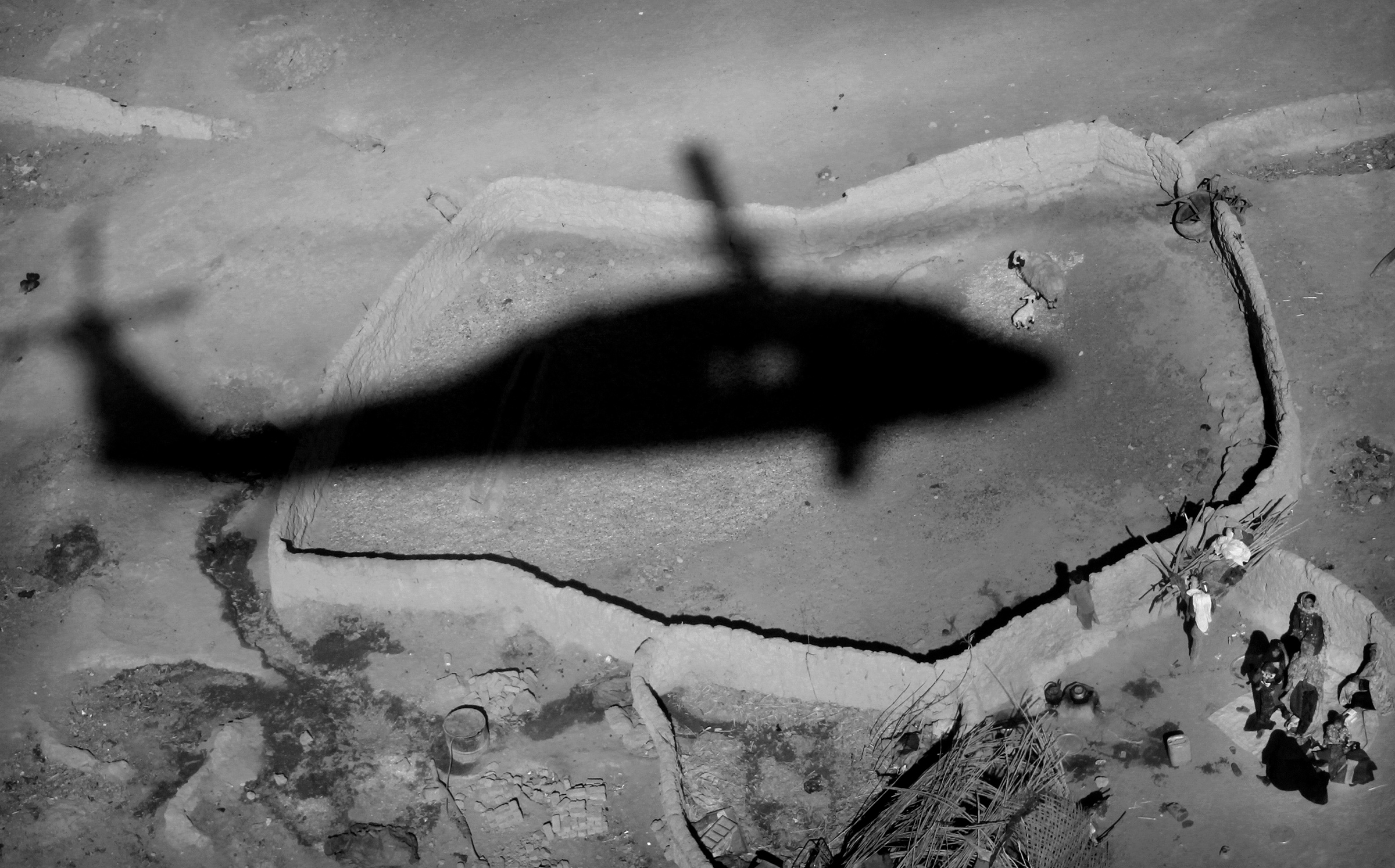 The shadow of a medevac helicopter from the U.S. Army's Task Force Shadow "Dust Off," Charlie Company 1-214 Aviation Regiment comes in for a landing during a mission near Marjah, southern Afghanistan, on Jan. 26, 2011.
