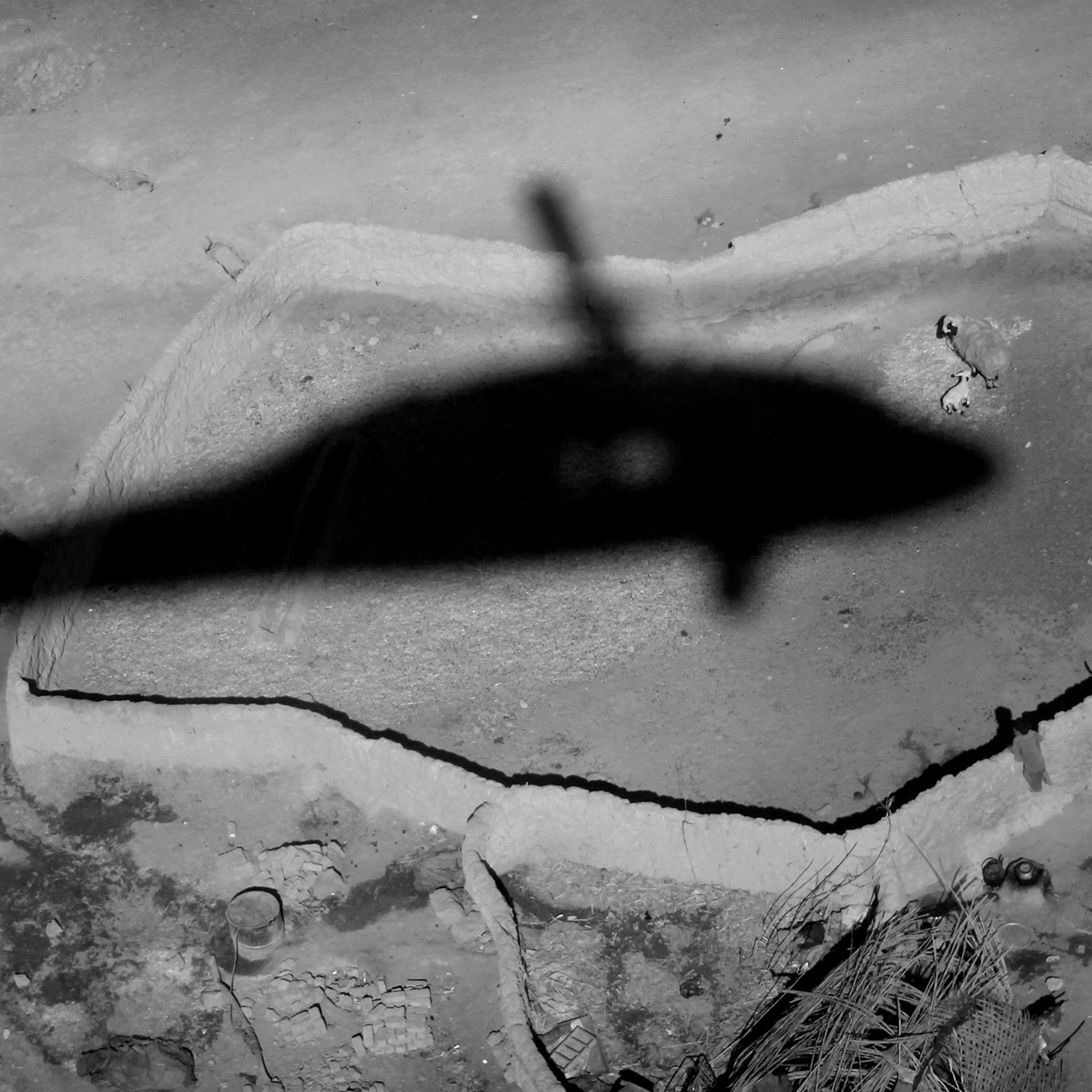 The shadow of a medevac helicopter from the U.S. Army's Task Force Shadow "Dust Off," Charlie Company 1-214 Aviation Regiment comes in for a landing during a mission near Marjah, southern Afghanistan, on Jan. 26, 2011.