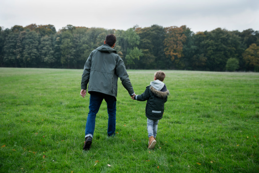 father-son-holding-hands-walking