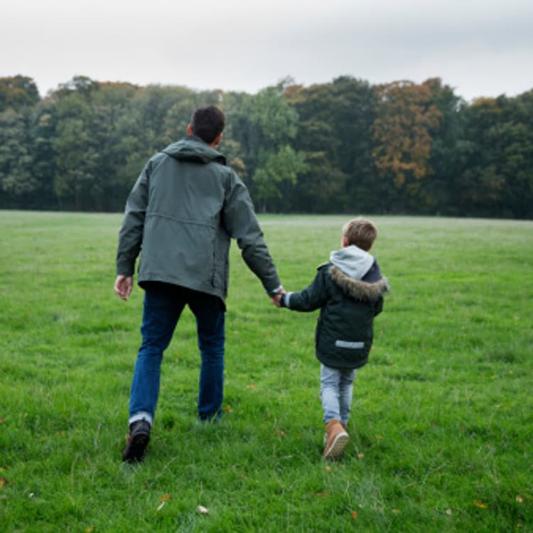 father-son-holding-hands-walking