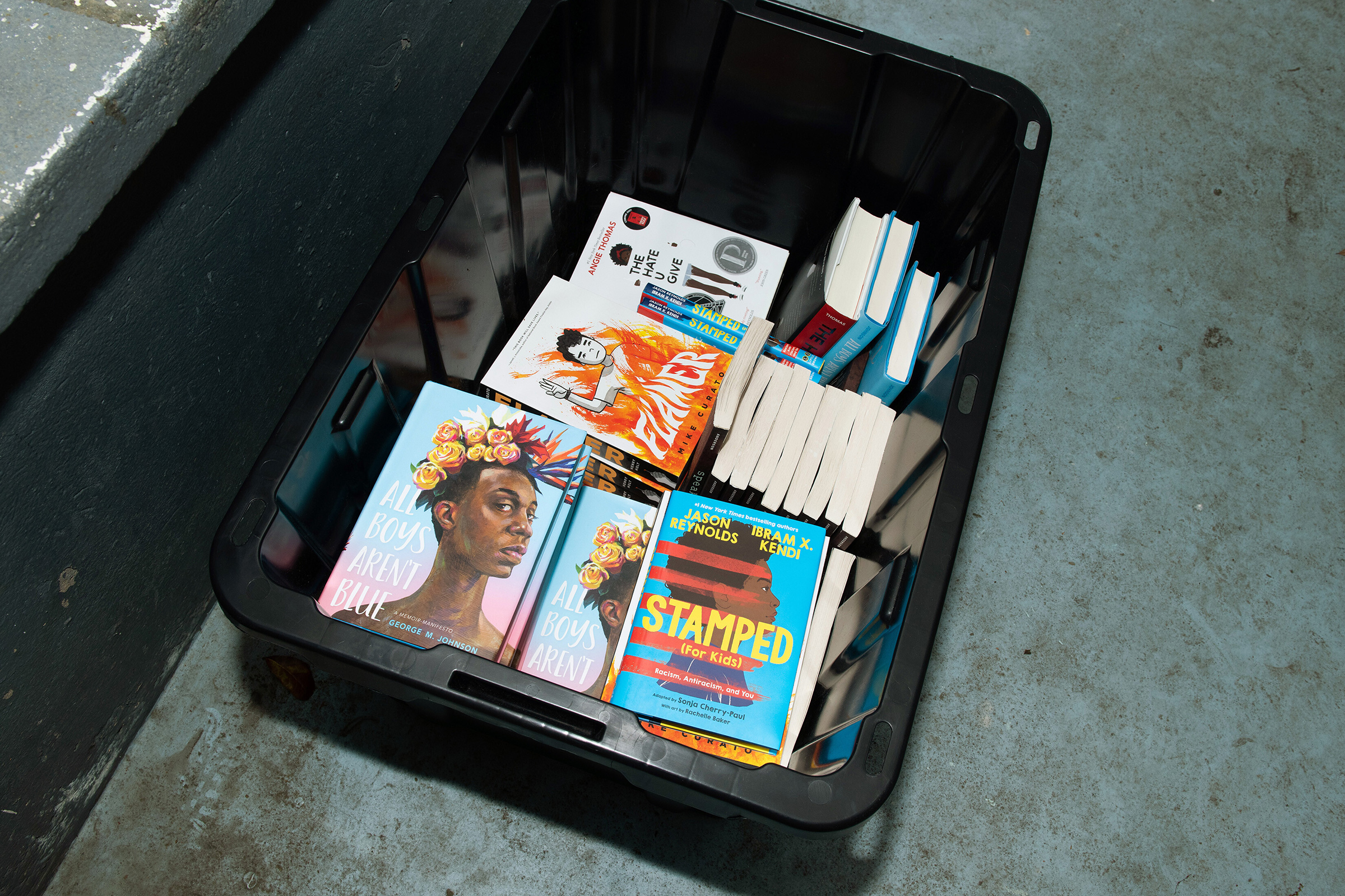 Books that are among a ban list at a rally in Tallahassee, Fla. on March 21. As book bans climb across the United States, Florida has become a hot spot, with laws that restrict books across the state.