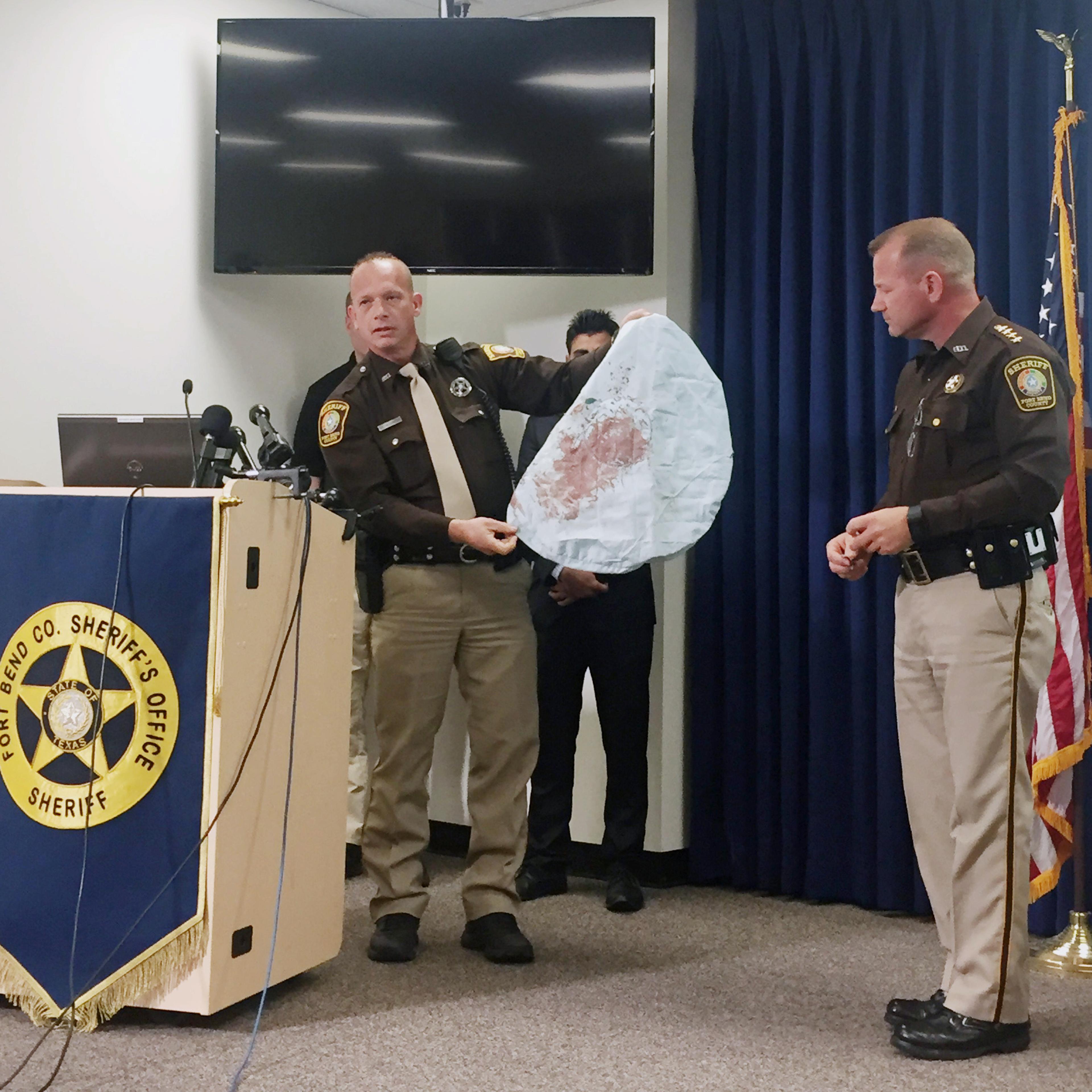 Deputy Danny Beckworth displays part of a defective airbag believed to have killed 17-year-old Huma Hanif during a news conference in Houston on April 7, 2016.