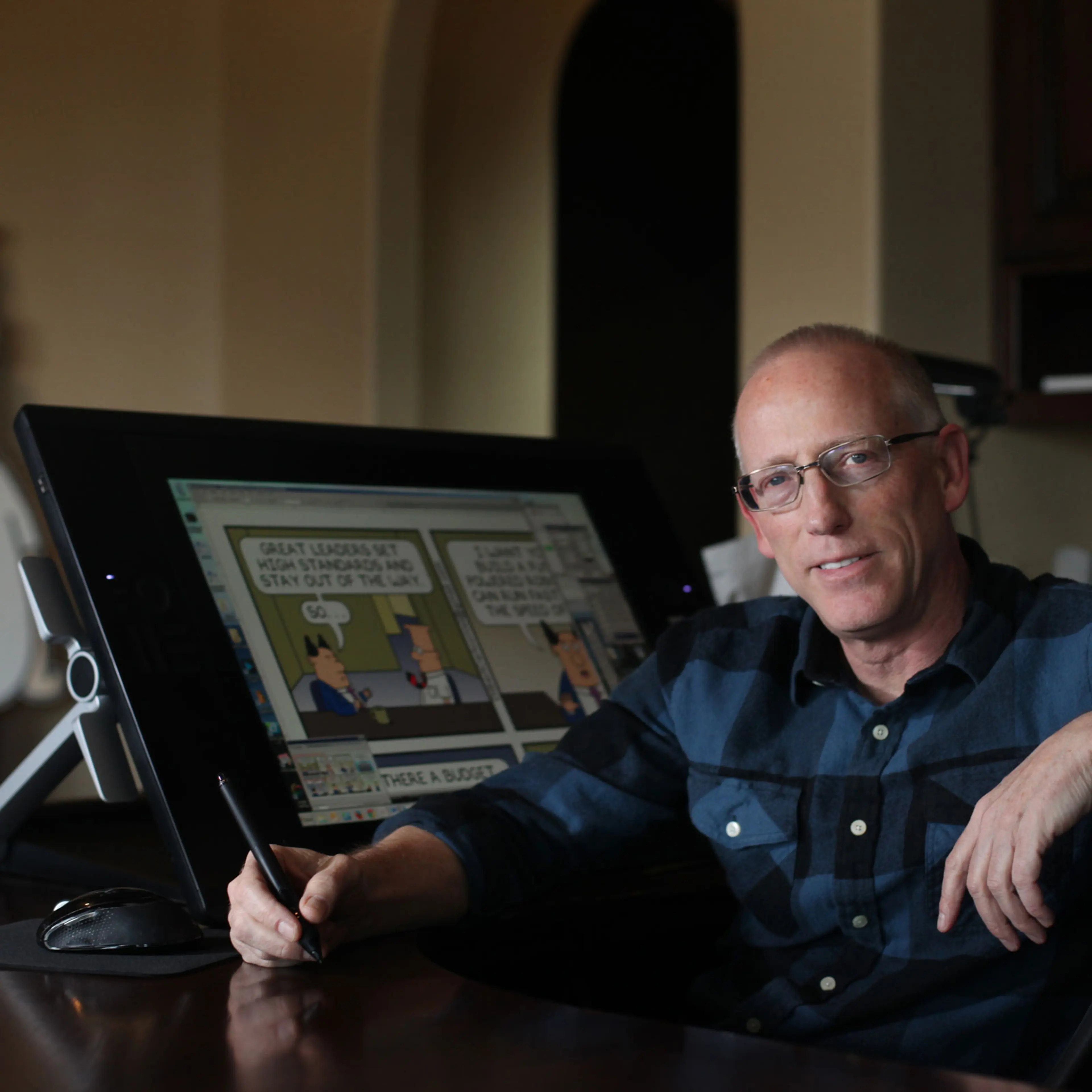 Scott Adams, cartoonist and author and creator of “Dilbert,” poses for a portrait in his home office in Pleasanton, Calif., on Jan. 6, 2014.