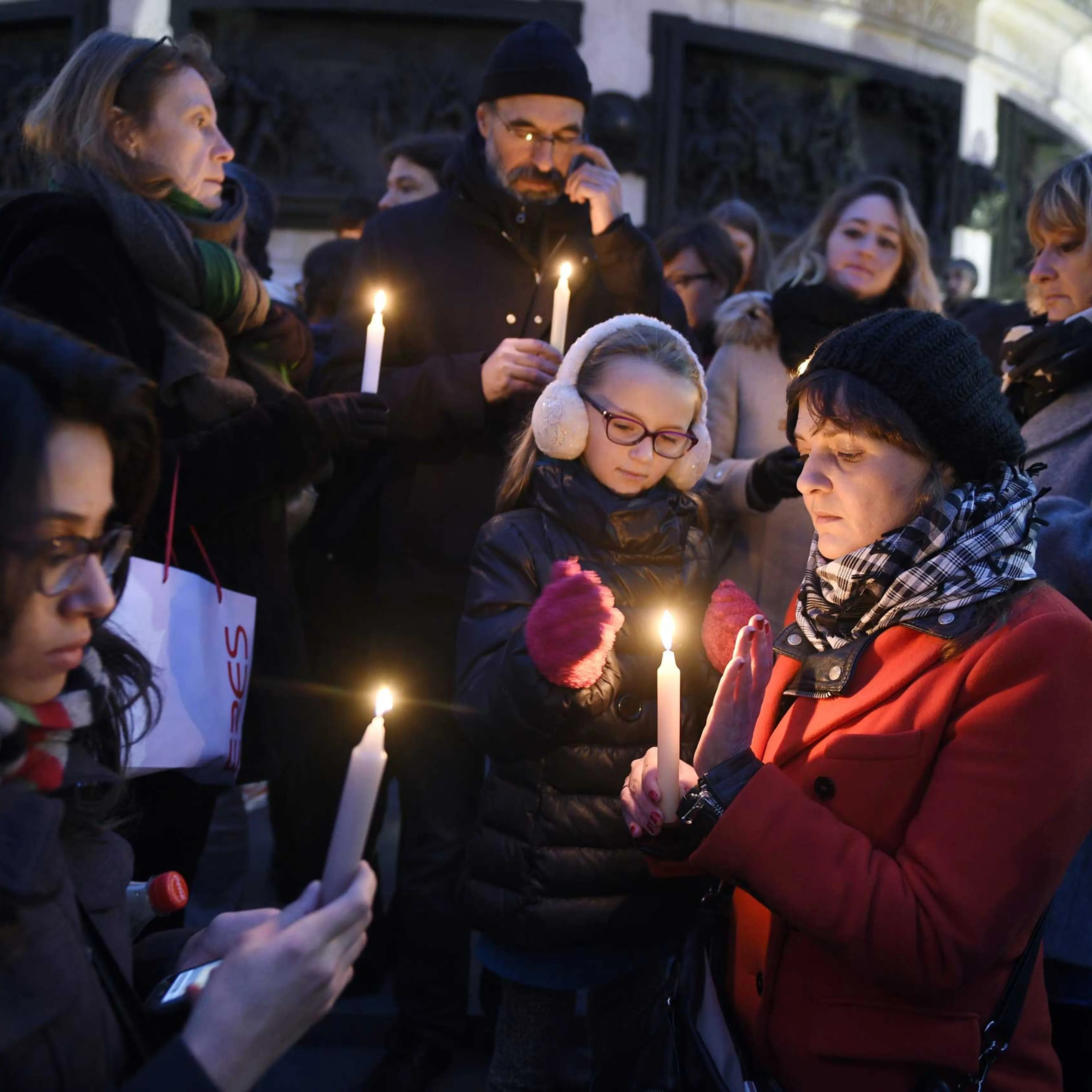 People like candles during a rally in support of the victims of the attack by gunmen at French satyrical newspaper Charlie Hebdo at the Place de la Republique in Paris, on Jan. 7, 2015.