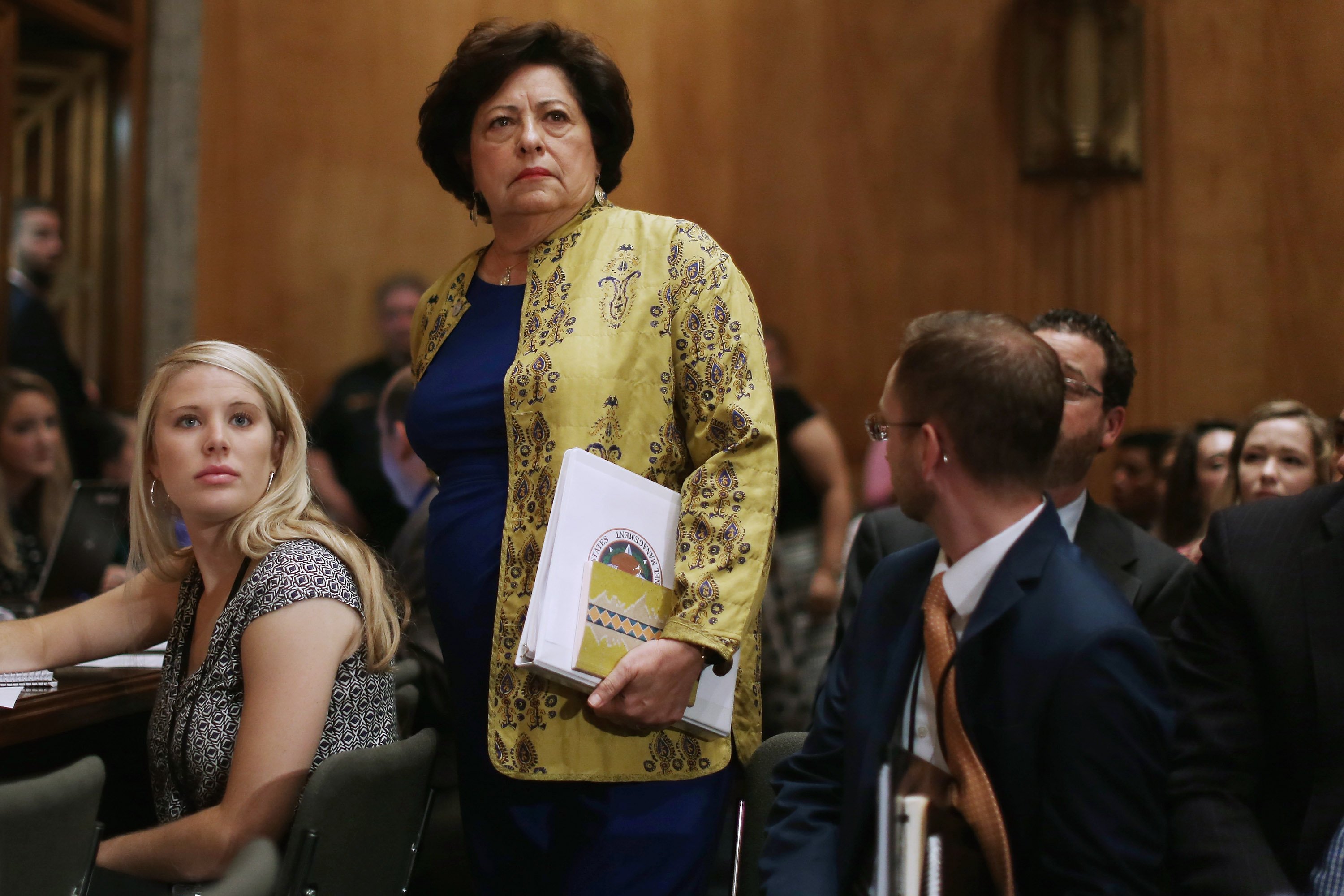 The Office of Personnel Management Director Katherine Archuleta arrives late for a hearing of the Senate Homeland Security and Governmental Affairs Committee about the recent OPM data breach in the Dirksen Senate Office Building on Capitol Hill June 25, 