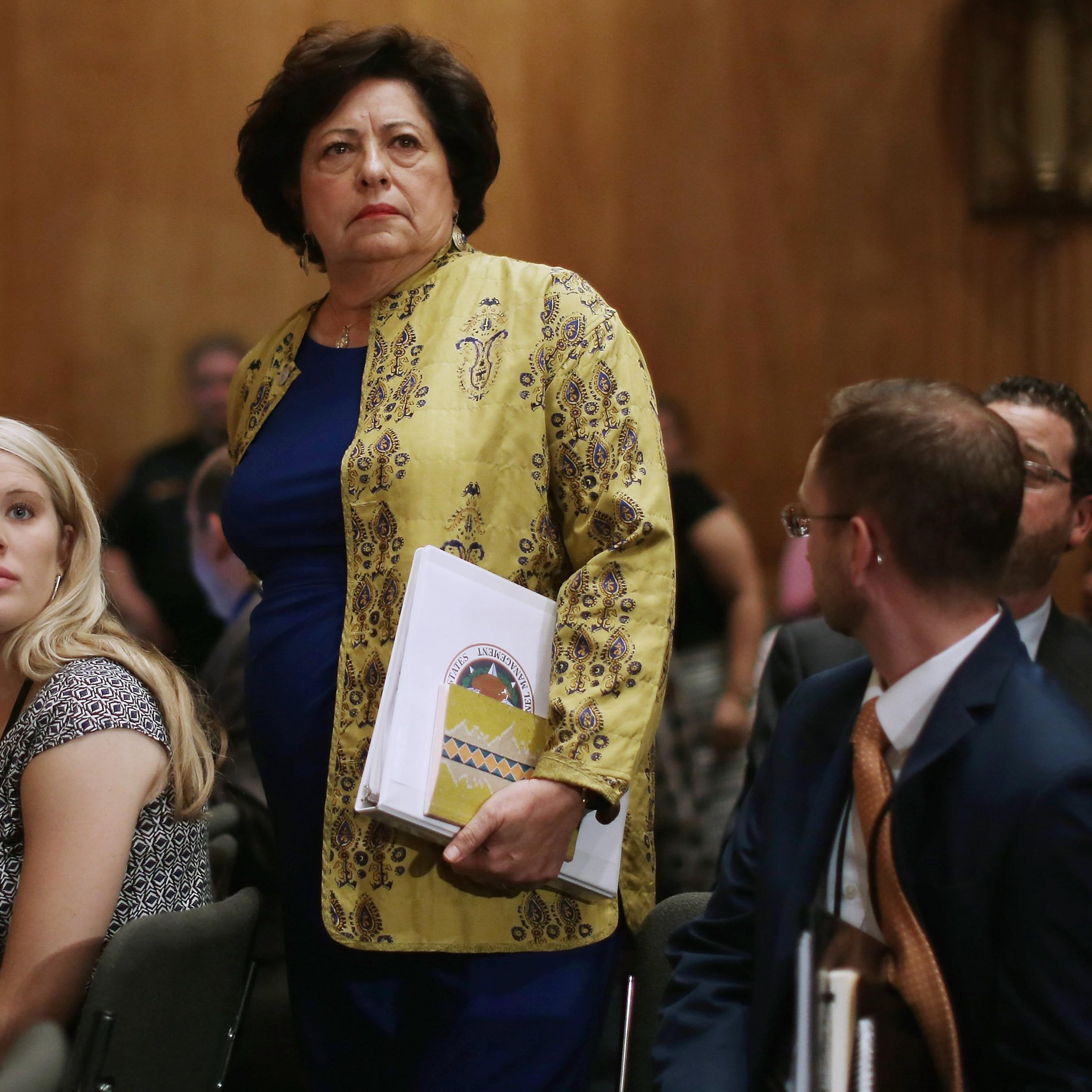 The Office of Personnel Management Director Katherine Archuleta arrives late for a hearing of the Senate Homeland Security and Governmental Affairs Committee about the recent OPM data breach in the Dirksen Senate Office Building on Capitol Hill June 25,
