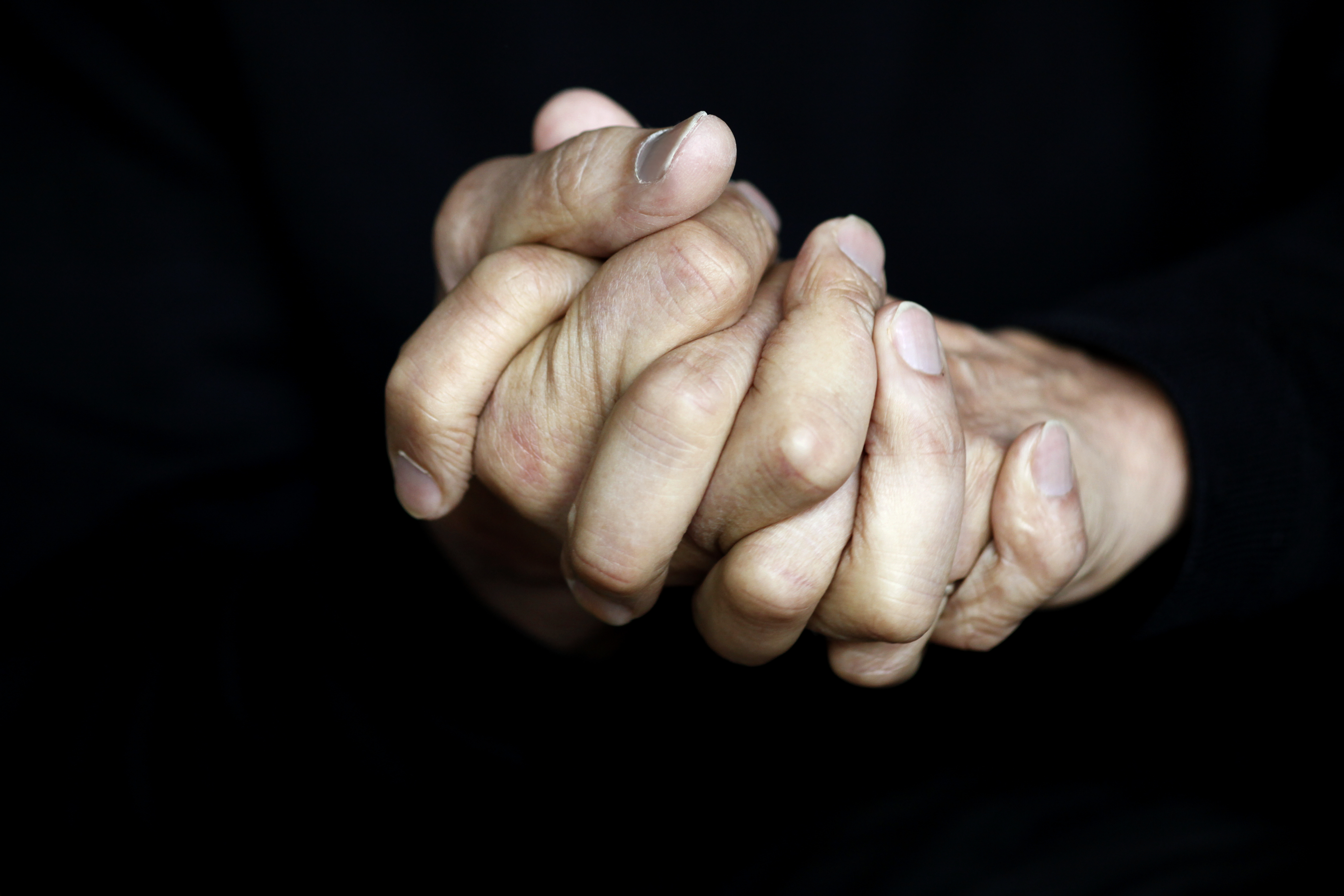 hands-clasped-together
