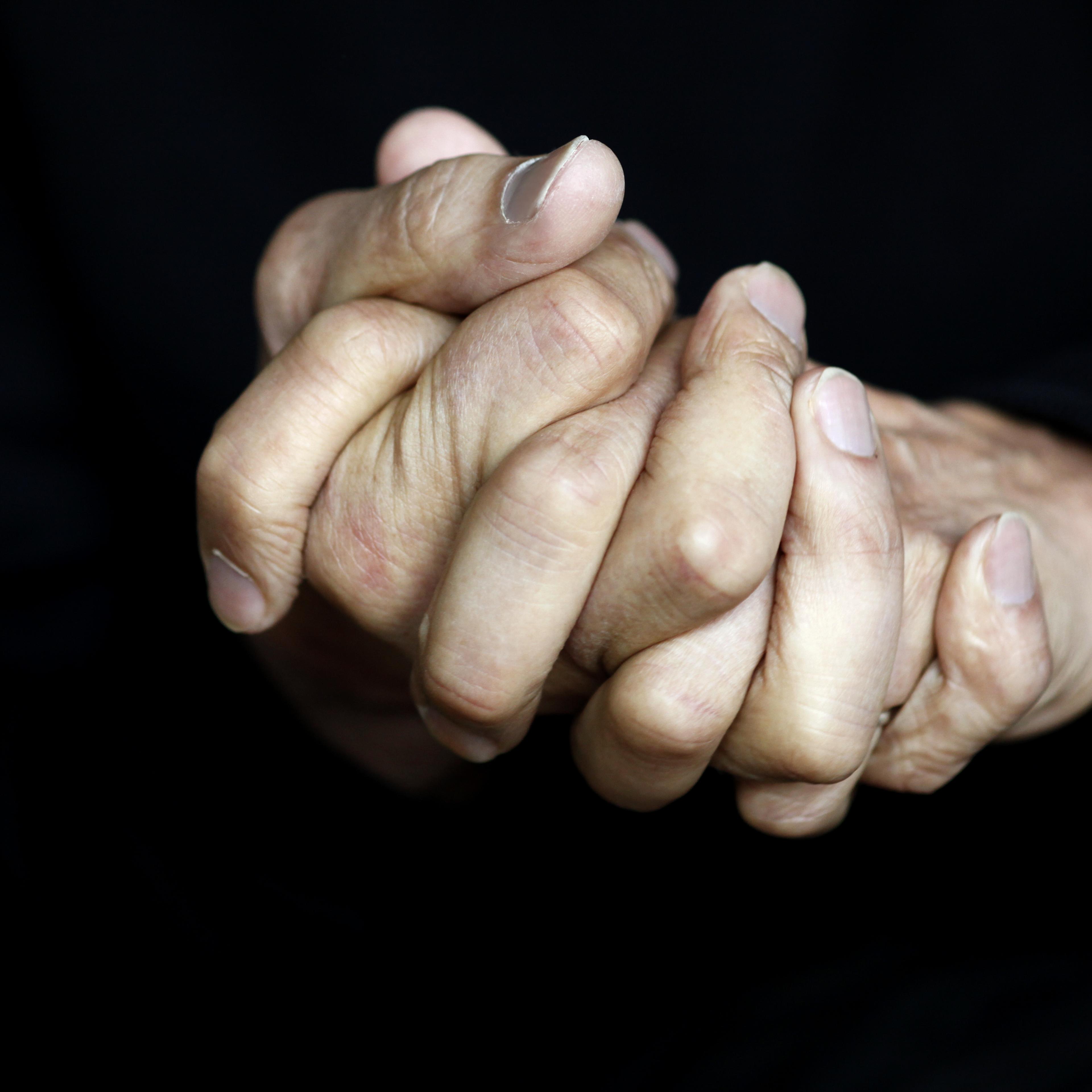 hands-clasped-together