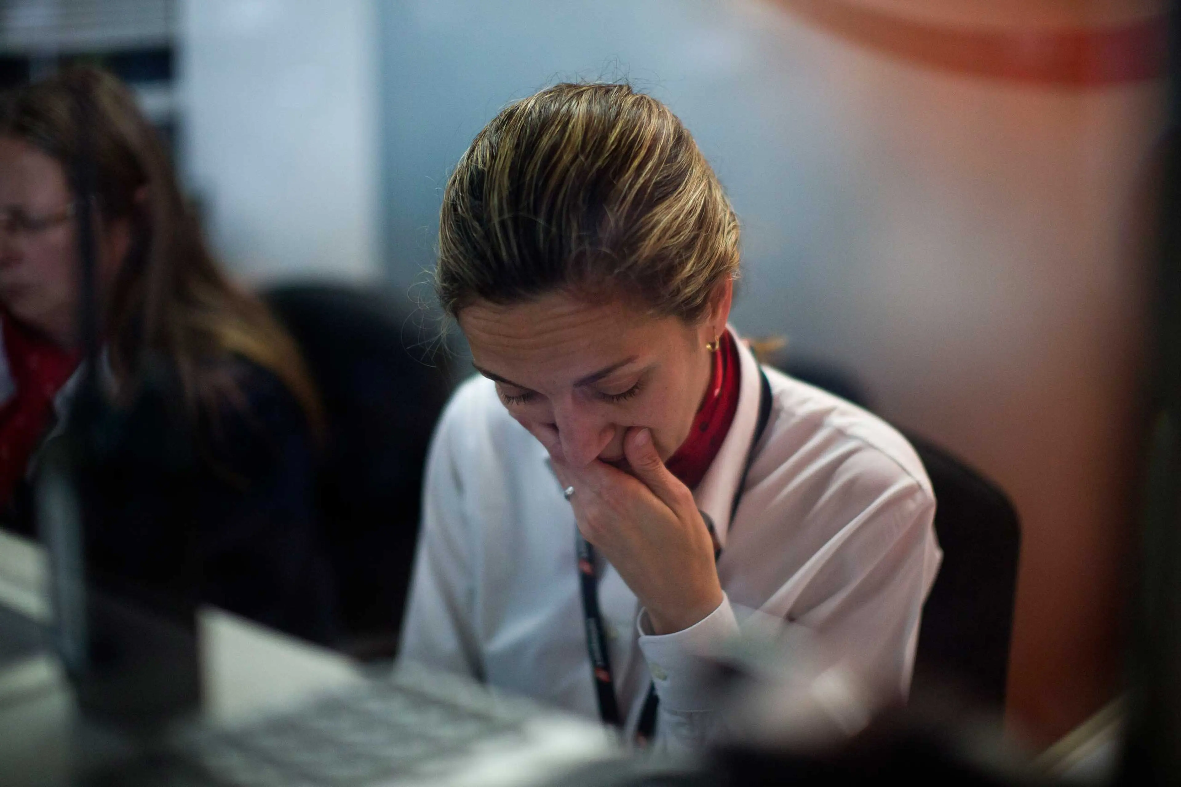 A worker from a Swissport, a Service Company who is handling for Germanwings airlines, works inside an office in the Barcelona airport, March 24, 2015.