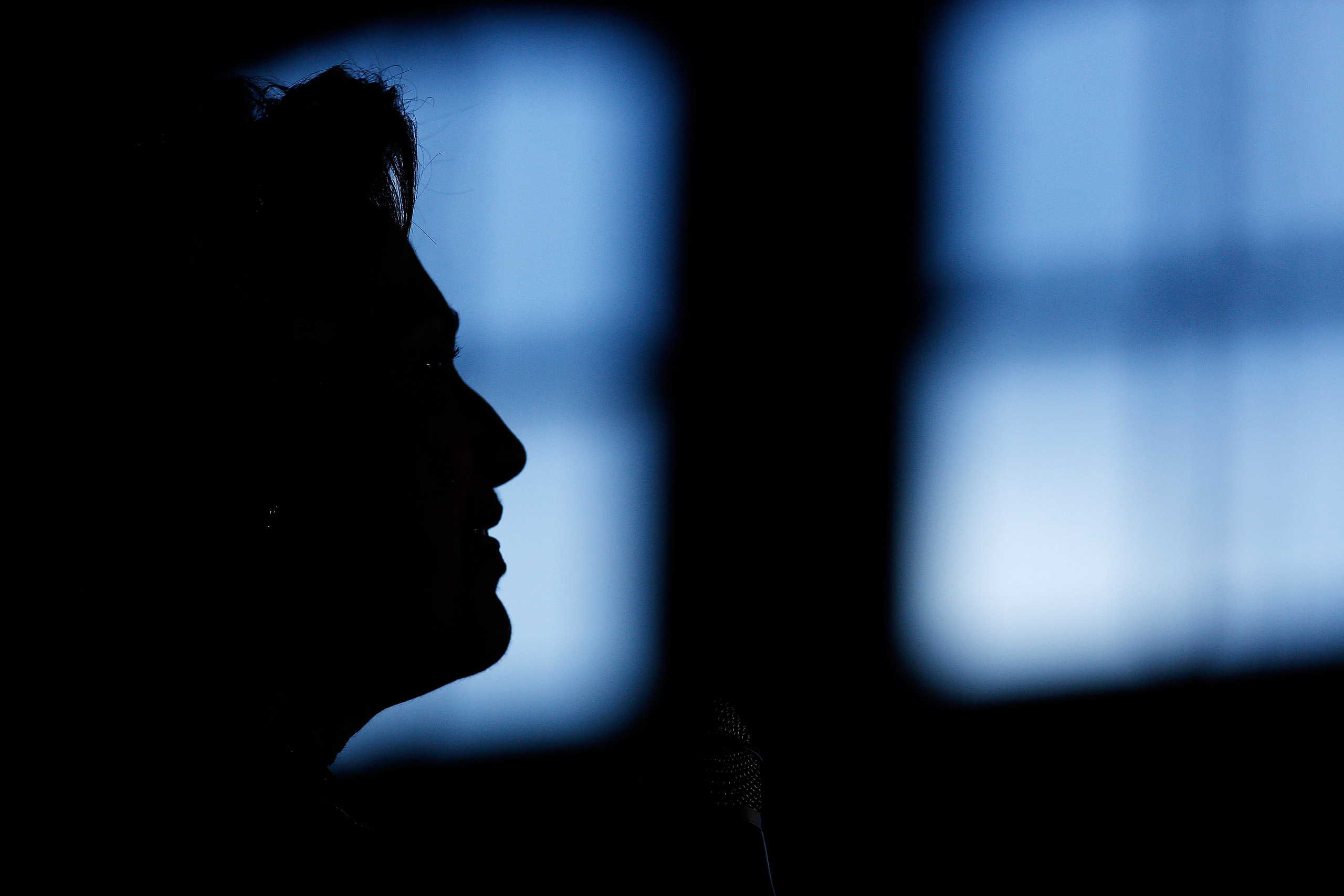 The silhouette of Hillary Clinton, former Secretary of State and 2016 Democratic presidential candidate, is seen during a campaign event in Louisville, Kentucky, U.S., on Tuesday, May 10, 2016. Clinton said she sees "a great role" for Bernie Sanders and 