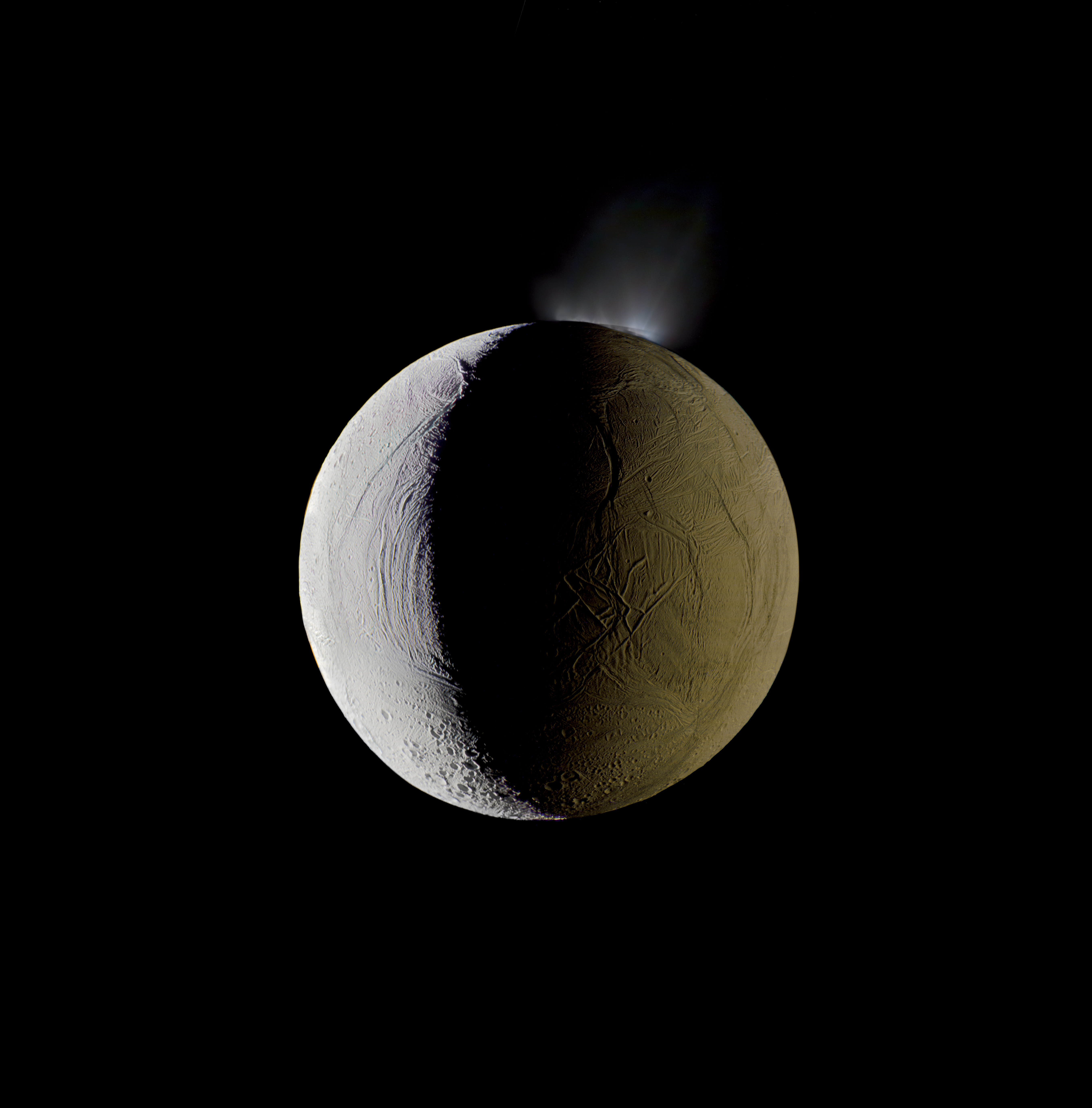 Enceladus vents water into space from its south polar region. The moon is lit by the Sun on the left, and backlit by the vast reflecting surface of its parent planet to the right. Icy crystals from these plumes are likely the source of Saturn’s nebulous E ring, within which Enceladus orbits. </br>
<i>Mosaic composite photograph.</br>
Cassini, Dec. 25, 2009</i>