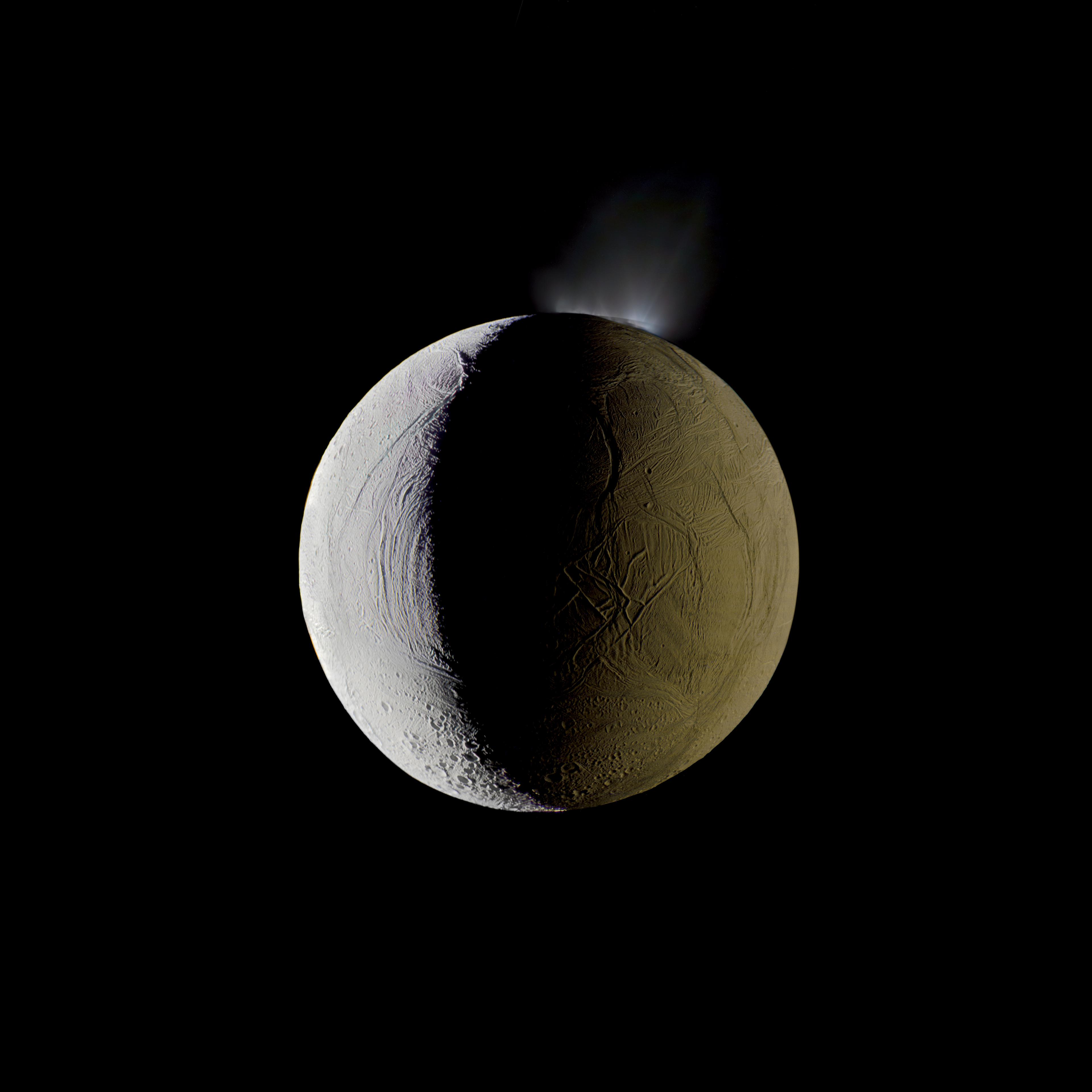 Enceladus vents water into space from its south polar region. The moon is lit by the Sun on the left, and backlit by the vast reflecting surface of its parent planet to the right. Icy crystals from these plumes are likely the source of Saturn’s nebulous E ring, within which Enceladus orbits. </br>
<i>Mosaic composite photograph.</br>
Cassini, Dec. 25, 2009</i>